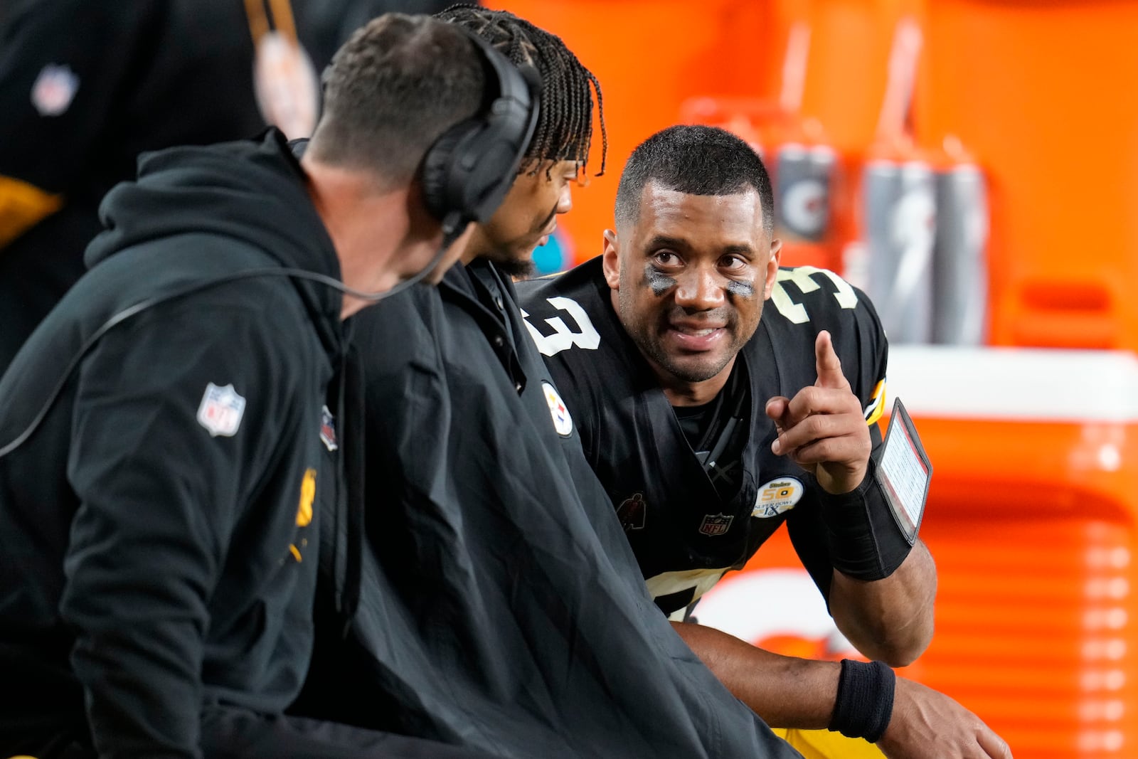 Pittsburgh Steelers quarterback Russell Wilson (3) talks on the bench in the second half of an NFL football game against the New York Jets in Pittsburgh, Sunday, Oct. 20, 2024. (AP Photo/Gene J. Puskar)