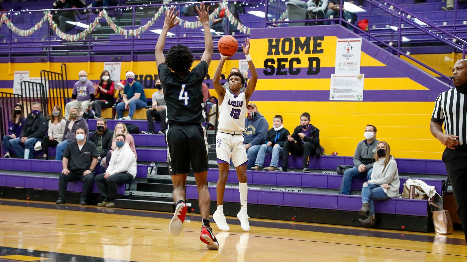 Emmanuel Christian Academy senior Jason Channels shoots the ball over Yellow Springs' Javas McNair during their game on Tuesday, Dec. 15. Channels and his brother Justus are two of the top scorers in the Metro Buckeye Conference this season. Michael Cooper/CONTRIBUTED