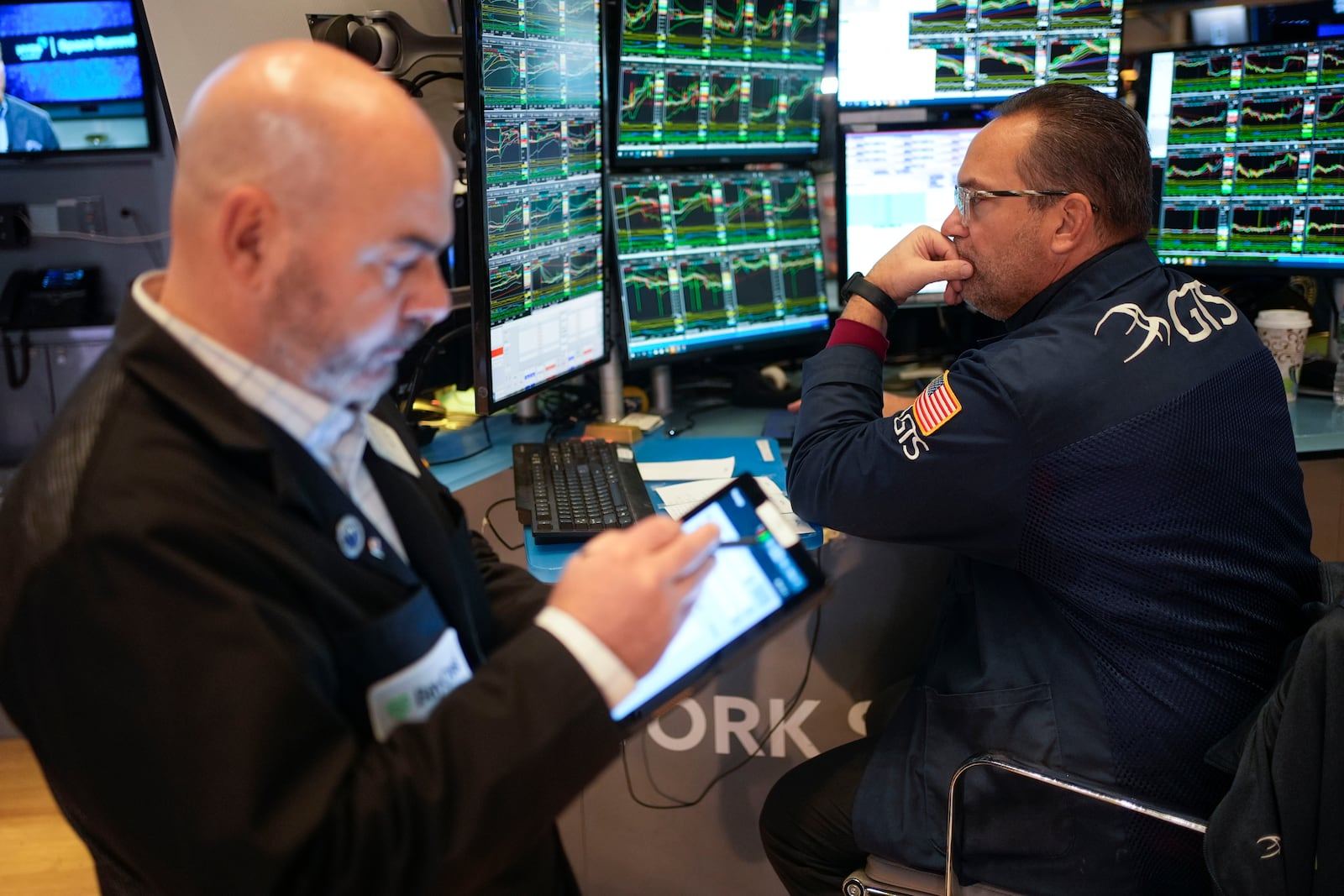 Traders work on the floor at the New York Stock Exchange in New York's Financial District Thursday, Jan. 2, 2025. (AP Photo/Seth Wenig)