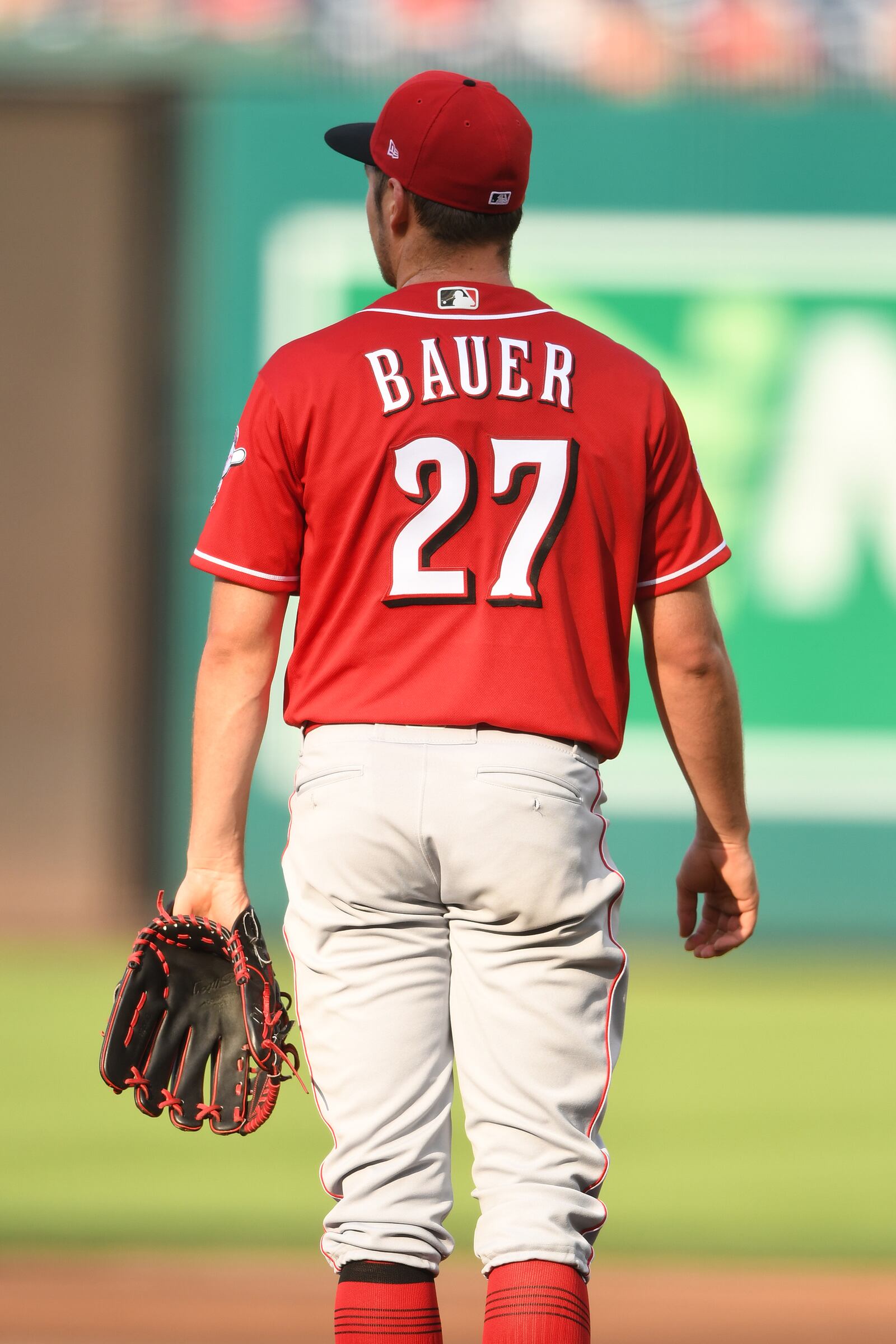 WASHINGTON, DC - AUGUST 14:  Trevor Bauer #27 of the Cincinnati Reds watches Adam Eaton's #2 of the Washington Nationals (not pictured) three run home run in the fifth inning during a baseball game against the Washington Nationals at Nationals Park on August 14, 2019 in Washington, DC.  (Photo by Mitchell Layton/Getty Images)