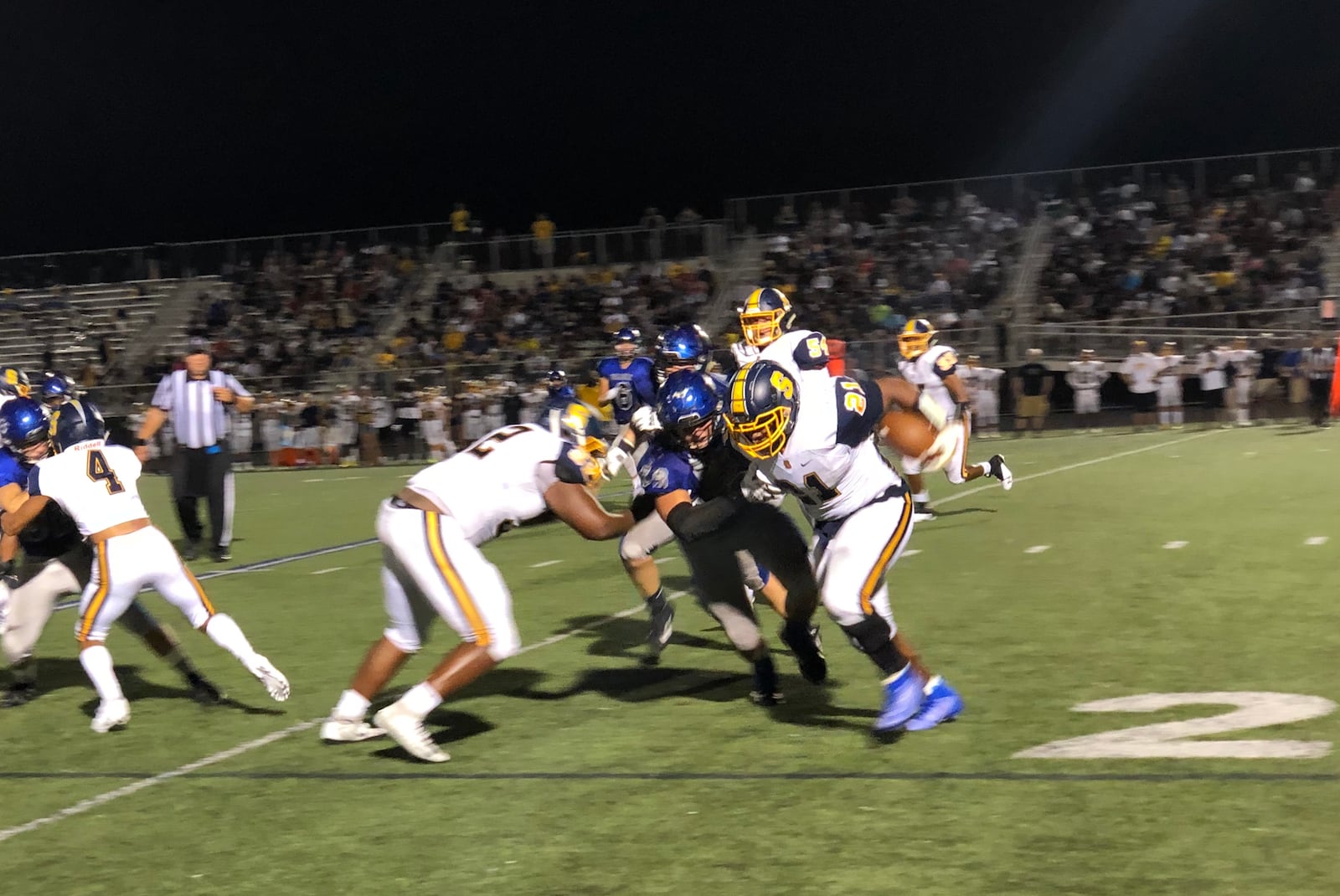 Caption won’t load for some reason: Springfield’s Tay’veon Smoot (21) fights for more yardage in the Wildcats’ big win over Hilliard Bradley on Friday night. Marcus Hartman/STAFF