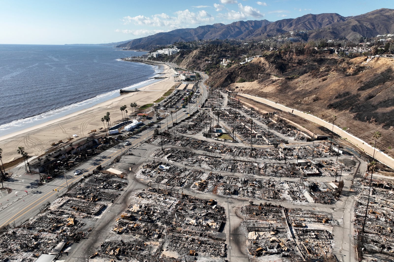 An aerial view shows the devastation left by the Palisades Fire in the Pacific Palisades section of Los Angeles, Monday, Jan. 27, 2025. (AP Photo/Jae C. Hong)