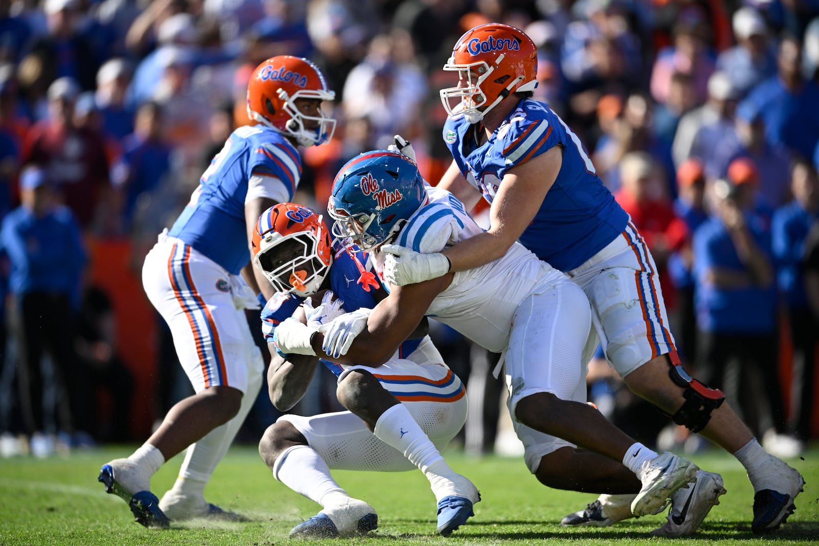 Florida running back Jadan Baugh (13) is tackled for a loss by Mississippi defensive tackle Walter Nolen (2) during the second half of an NCAA college football game, Saturday, Nov. 23, 2024, in Gainesville, Fla. (AP Photo/Phelan M. Ebenhack)