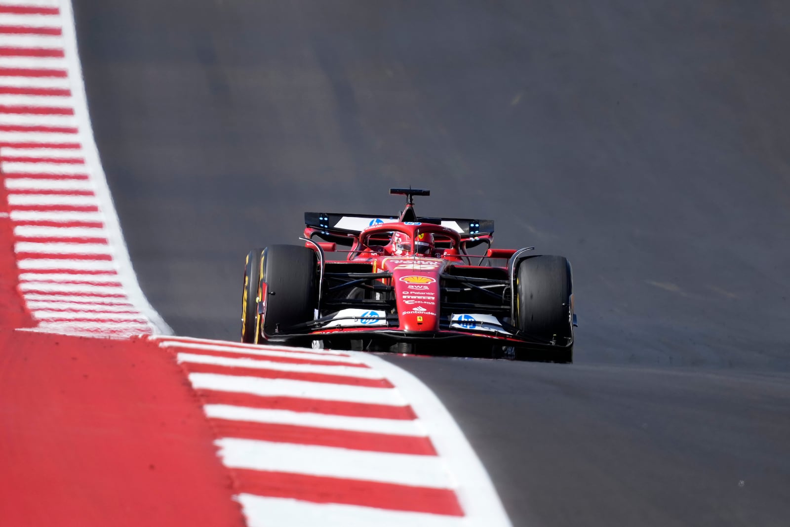 Ferrari driver Charles Leclerc, of Monaco, heads into Turn 1 during the U.S. Grand Prix auto race at Circuit of the Americas, Sunday, Oct. 20, 2024, in Austin, Texas. (AP Photo/Eric Gay)