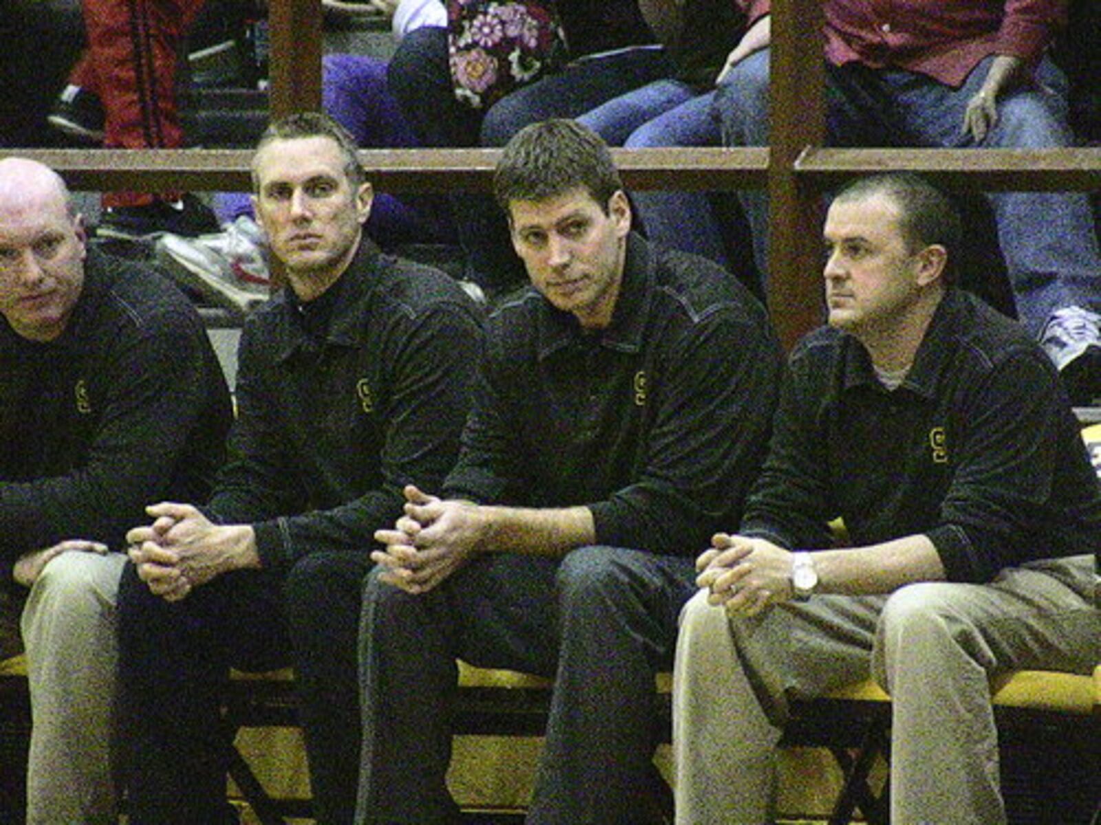 Shawnee coach Chris McGuire, second from right, and his staff. Kenton Ridge beat Shawnee 42-40 on Friday, Jan. 28, 2011, at Kenton Ridge.