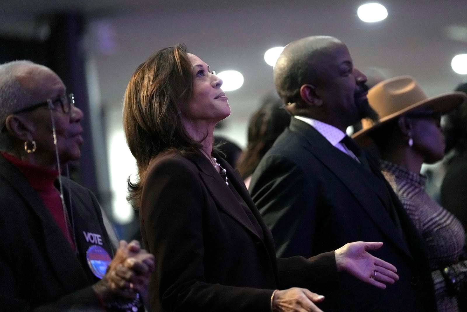 Democratic presidential nominee Vice President Kamala Harris, second left, attends a service at the Church of Christian Compassion, Sunday, Oct. 27, 2024, in Philadelphia. (AP Photo/Susan Walsh)