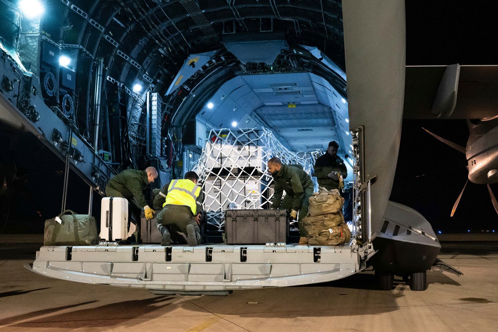 This photo provided Sunday Dec.15, 2024 by the French Army shows soldiers loading relief for the island of Mayotte, in the Indian Ocean, after Cyclone Chido caused extensive damage with reports of several fatalities, Saturday Dec.14, 2024 in Orleans, central France. (Laure-Anne Maucorps/ Etat Major des Armées via AP)