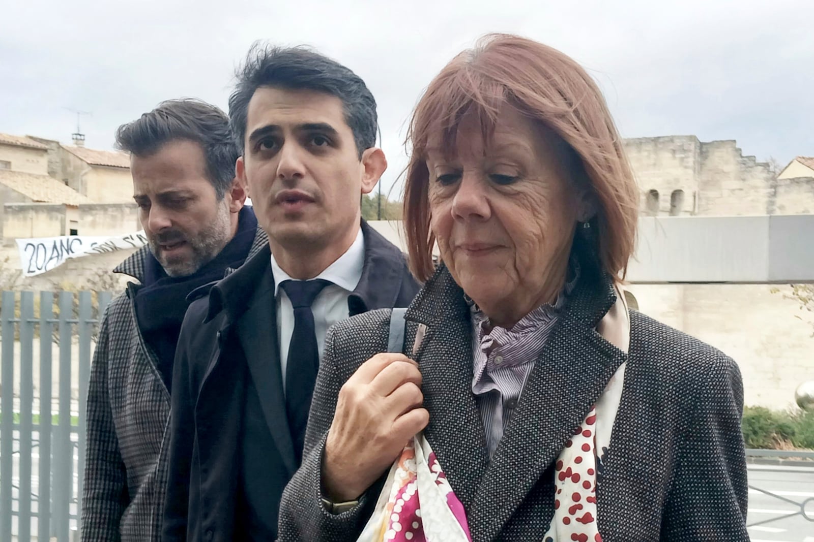 Gisele Pelicot, right, arrives with lawyers Antoine Camus, left, and Stéphane Babonneauat the palace of justice after a break Monday, Nov. 25, 2024 in Avignon, southern France, after the prosecutor asked for the maximum possible penalty for aggravated rape, 20 years, against Gisèle Pelicot's now ex-husband Dominique Pelicot. (AP Photo/Marine Lesprit)