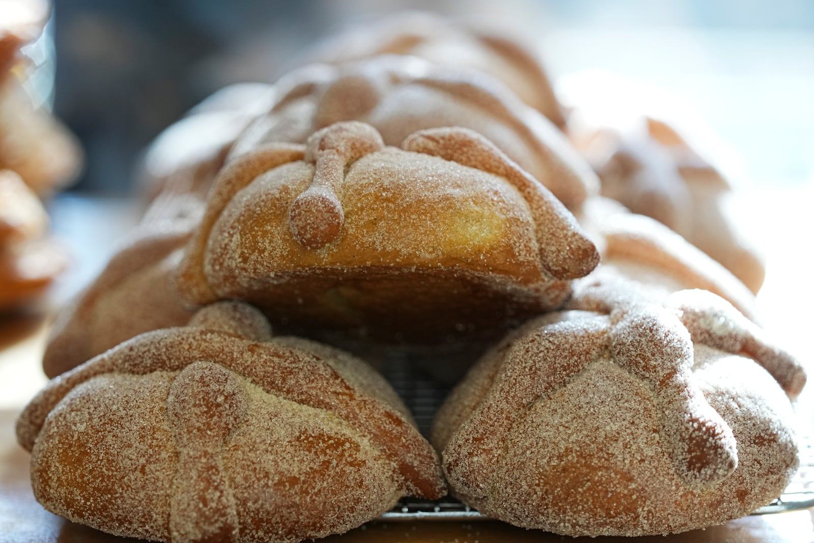 Pan de muerto, or "bread of the dead," traditional for Mexico's Day of the Dead, sits for sale at a bakery in the San Rafael neighborhood of Mexico City, Thursday, Oct. 17, 2024. (AP Photo/Fernando Llano)