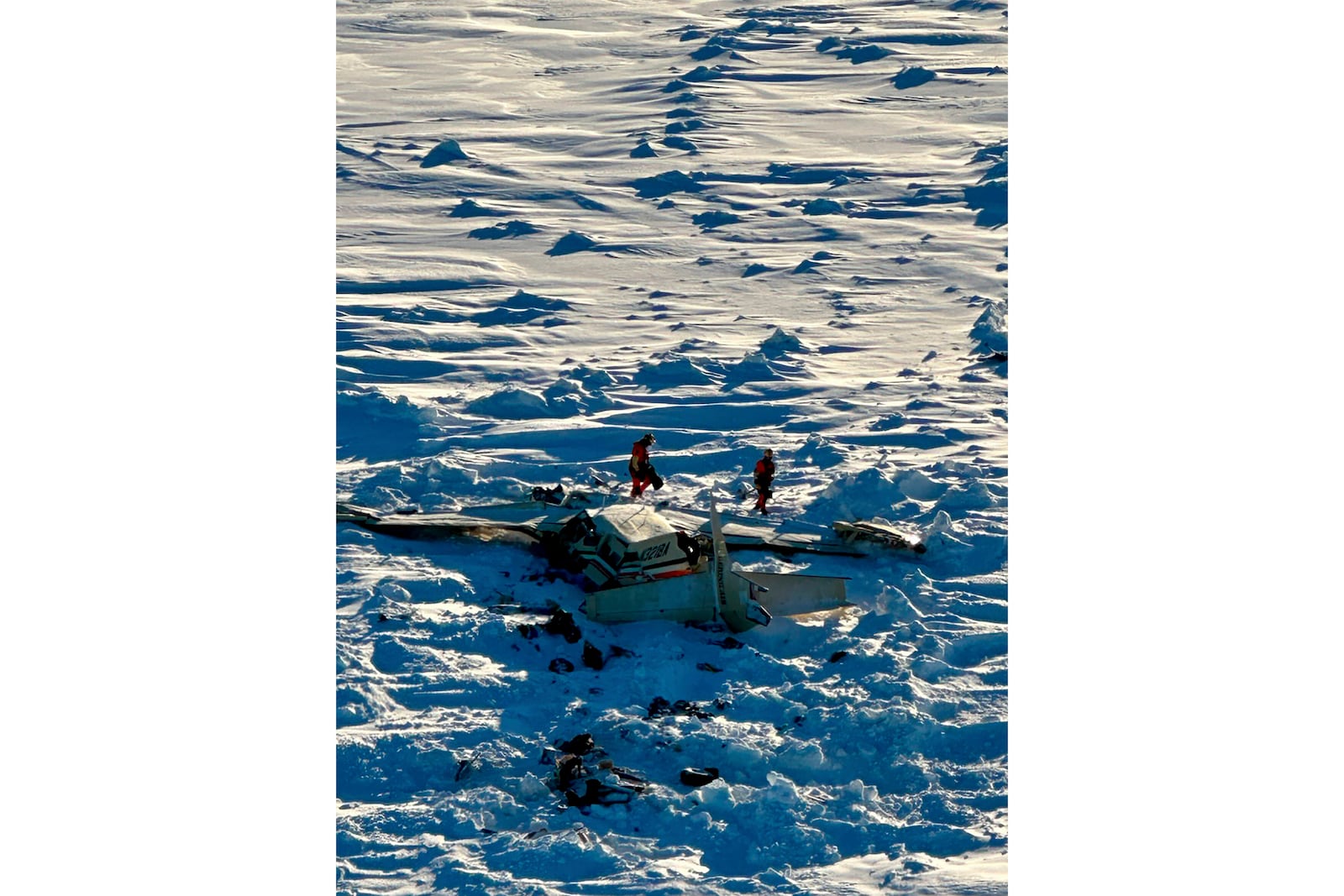 This photo provided by the U.S. Coast Guard on Friday, Feb. 7, 2025, shows a small commuter plane that crashed in western Alaska on a flight that was bound for the hub community of Nome. (U.S. Coast Guard via AP)