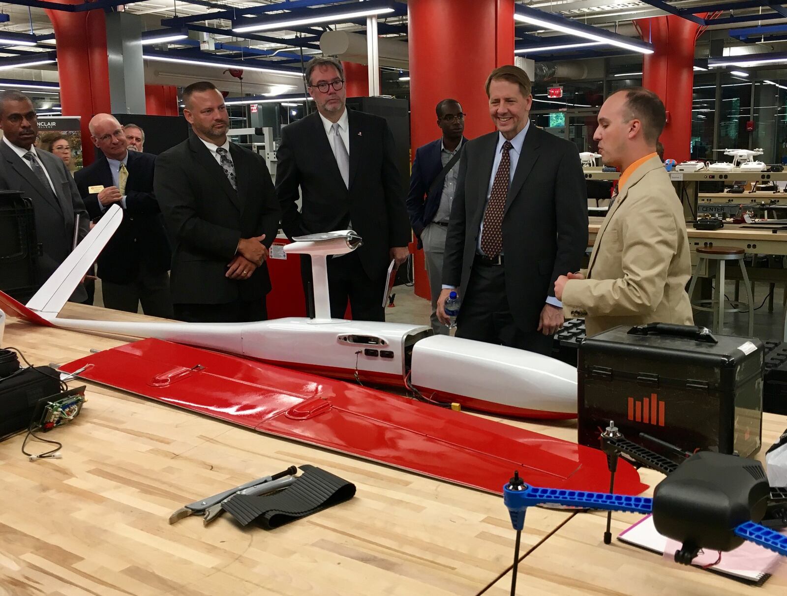 Rich Cordray, the Democrat running for Ohio governor, discussed his workforce development plan on Monday at the National Unmanned Aerial Systems (UAS) Training and Certification Center at Sinclair Community College in Dayton. Cordray (second from right) met with Sinclair President Steven L. Johnson (fourth from right) and UAS staff during tour of the center. Cordray’s running mate is former U.S. Rep. Betty Sutton. LYNN HULSEY/Staff