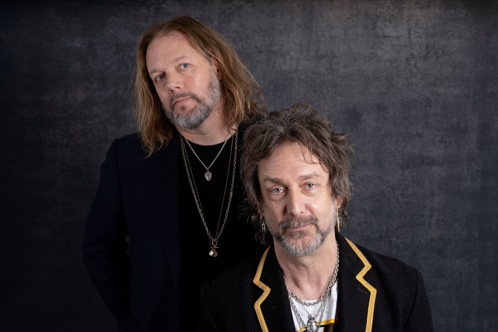 Rich Robinson, left, and his brother Chris Robinson of The Black Crowes pose for a portrait in Los Angeles on Monday, Dec. 9, 2024. (AP Photo/Richard Vogel)