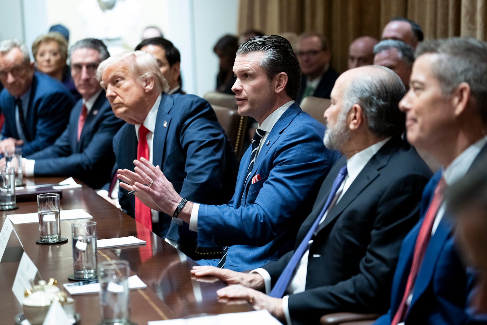 
                        FILE — Secretary of Defense Pete Hegseth speaks alongside President Donald Trump during President Trump’s first Cabinet meeting in the Cabinet Room of the White House in Washington, Feb. 26, 2025. Hegseth is rushing to reshape the military, in part by shifting money and making cuts. (Doug Mills/The New York Times)
                      