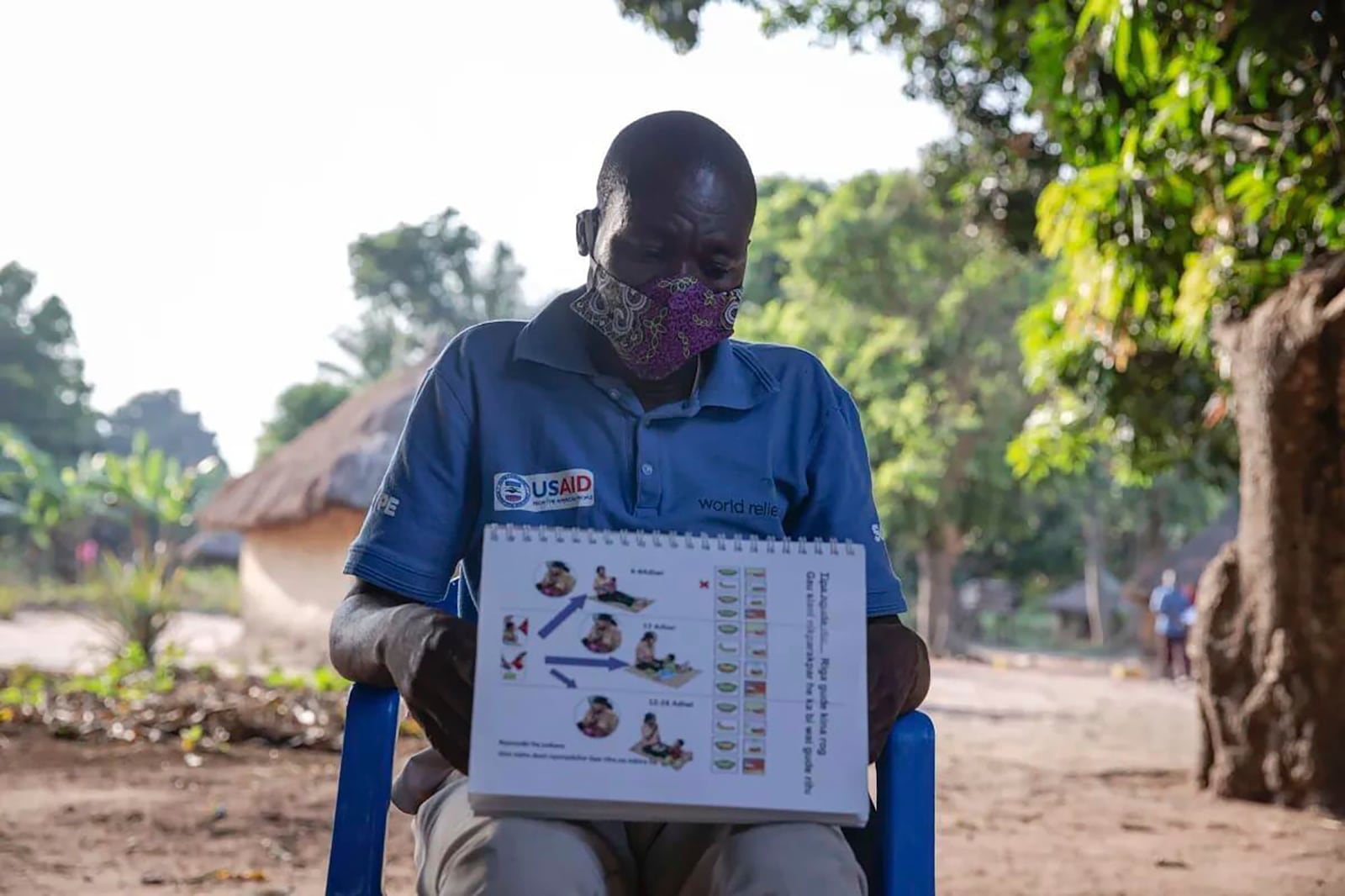 This photo provided by World Relief shows a care group volunteer, who provides community health education, during a meeting in Jan. 2022 in Ibba, South Sudan. (Esther Mbabazi/World Relief via AP)