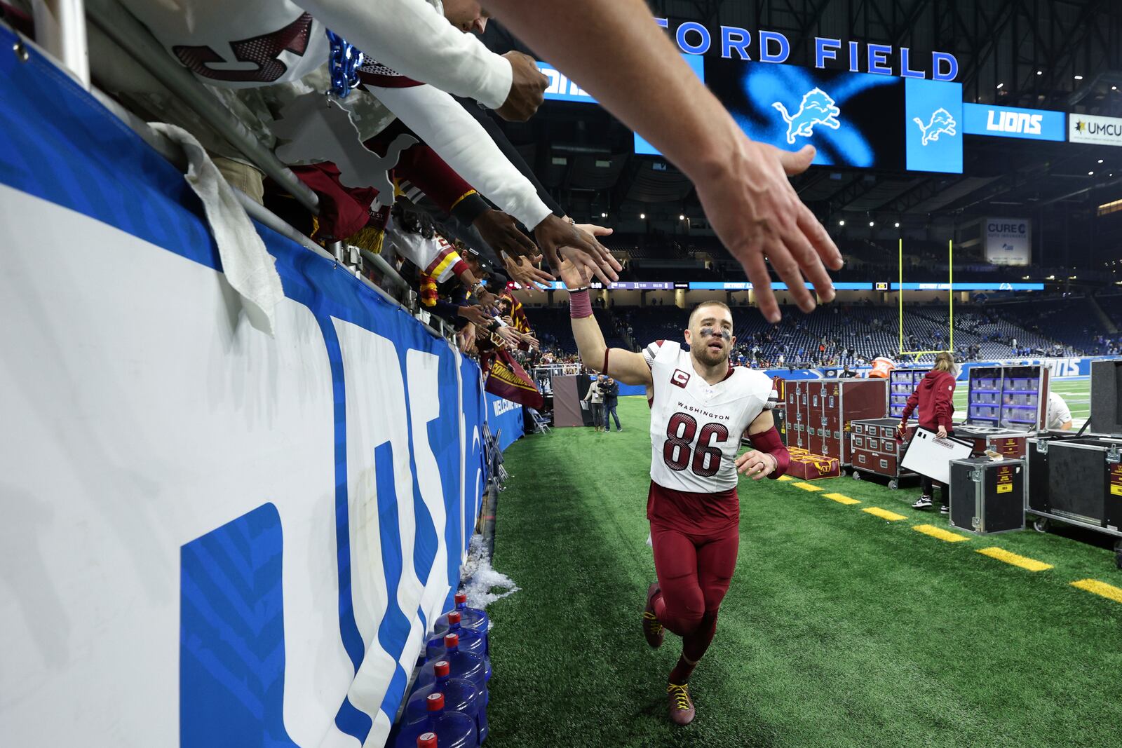 Washington Commanders tight end Zach Ertz (86) celebrates with fans after an NFL football divisional playoff game against the Detroit Lions , Saturday, Jan. 18, 2025, in Detroit. (AP Photo/Mike Mulholland)