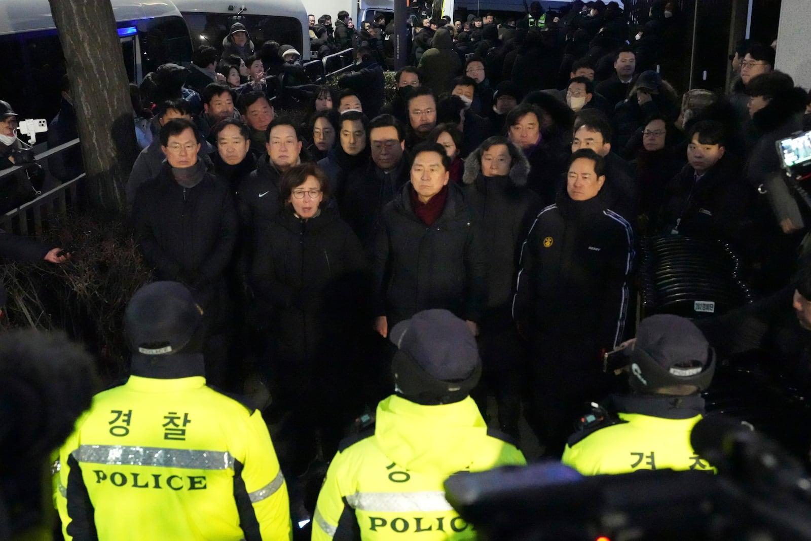 Lawmakers from the ruling People Power Party speak to media outside of the gate of the presidential residence in Seoul, South Korea, Wednesday, Jan. 15, 2025. (AP Photo/Lee Jin-man)