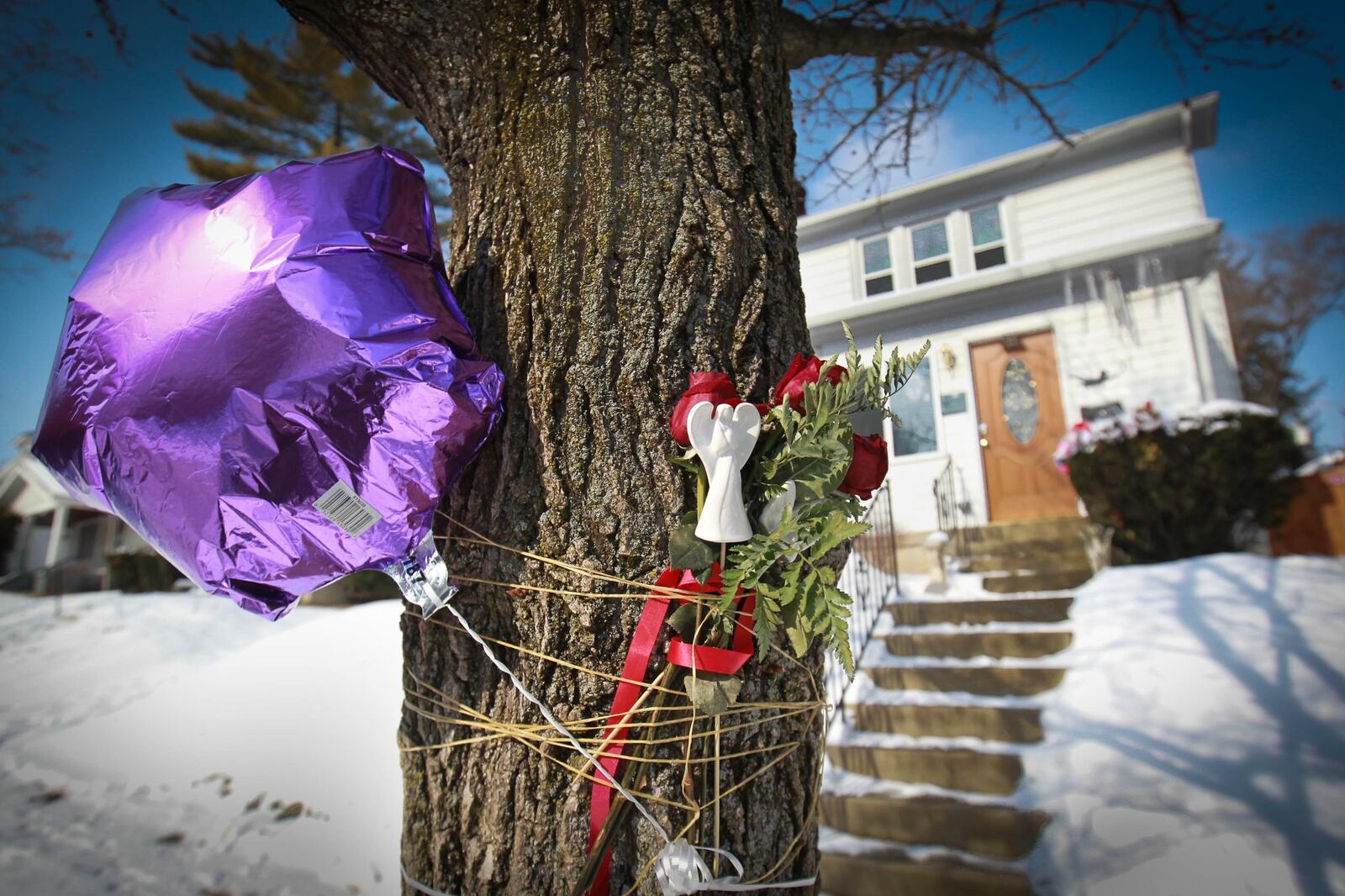 Balloons, flowers and other items were placed in front of Klonda Richey’s home, 31 E. Bruce Avenue in Dayton where she was mauled to death by a neighbor’s pit bull dogs after nine previous complaints filed about the two dogs who fatally attacked her. FILE