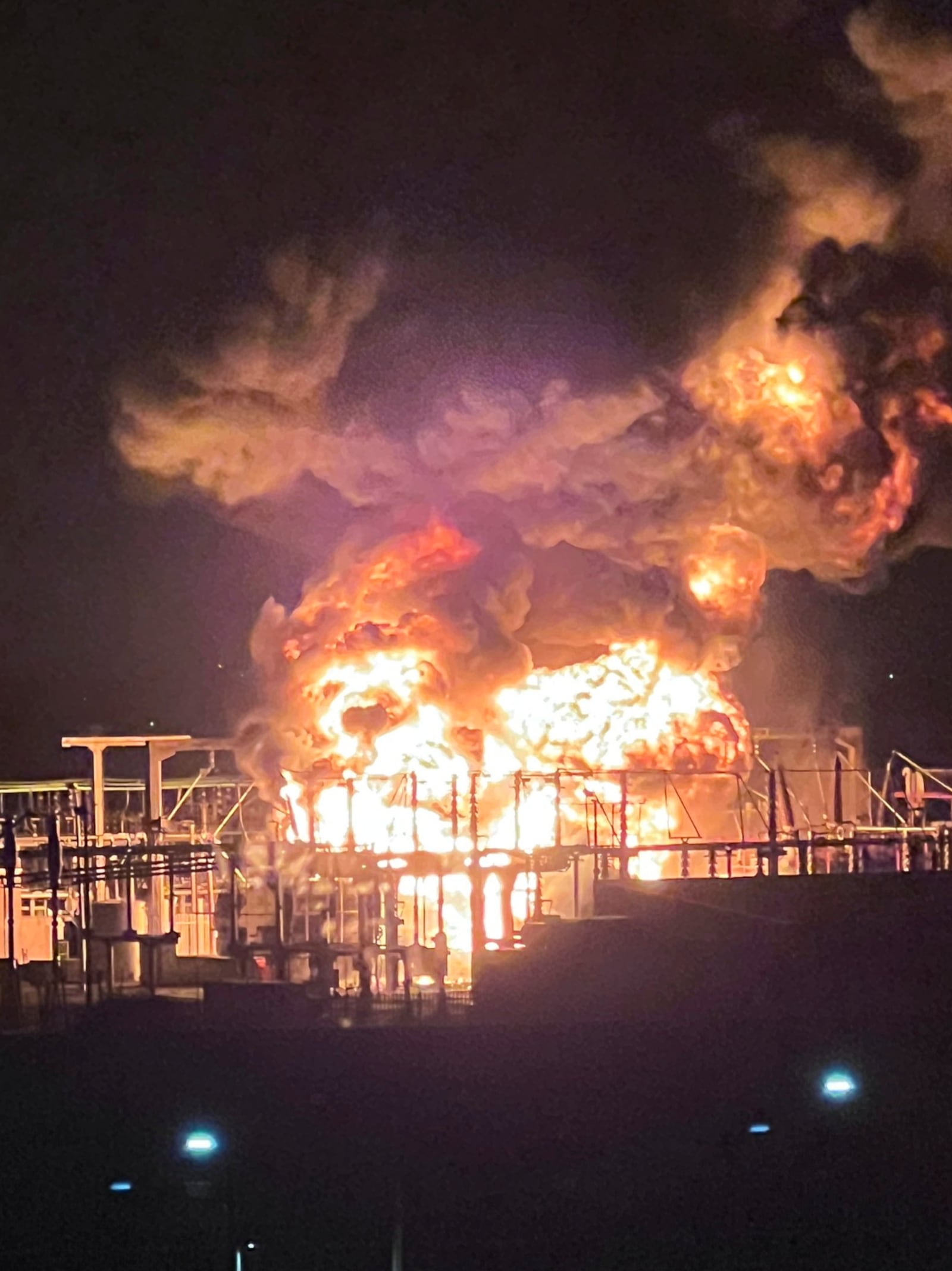 In this photo provided by Matthew Muirhead, a fire is seen at the North Hyde electrical substation near the Heathrow Airport in London, early Friday, March 21, 2025. (Matthew Muirhead via AP)