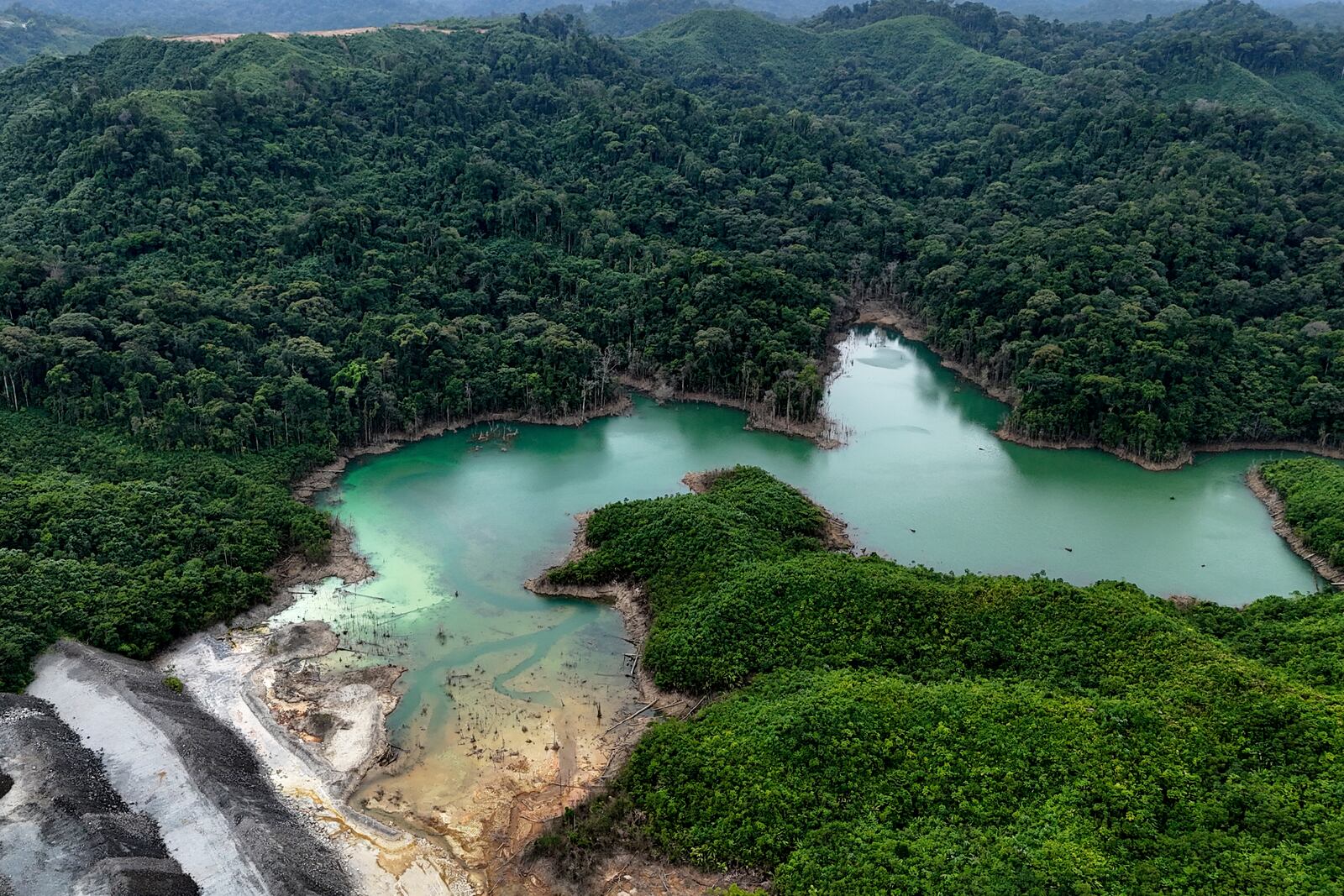 A tailing pond sits in the Cobre Panamá copper mine, owned by Canada's First Quantum Minerals, during a media tour of the mine that was closed after Panama's Supreme Court ruled that the government concession was unconstitutional, in Donoso, Panama, Friday, March 21, 2025. (AP Photo/Matias Delacroix)