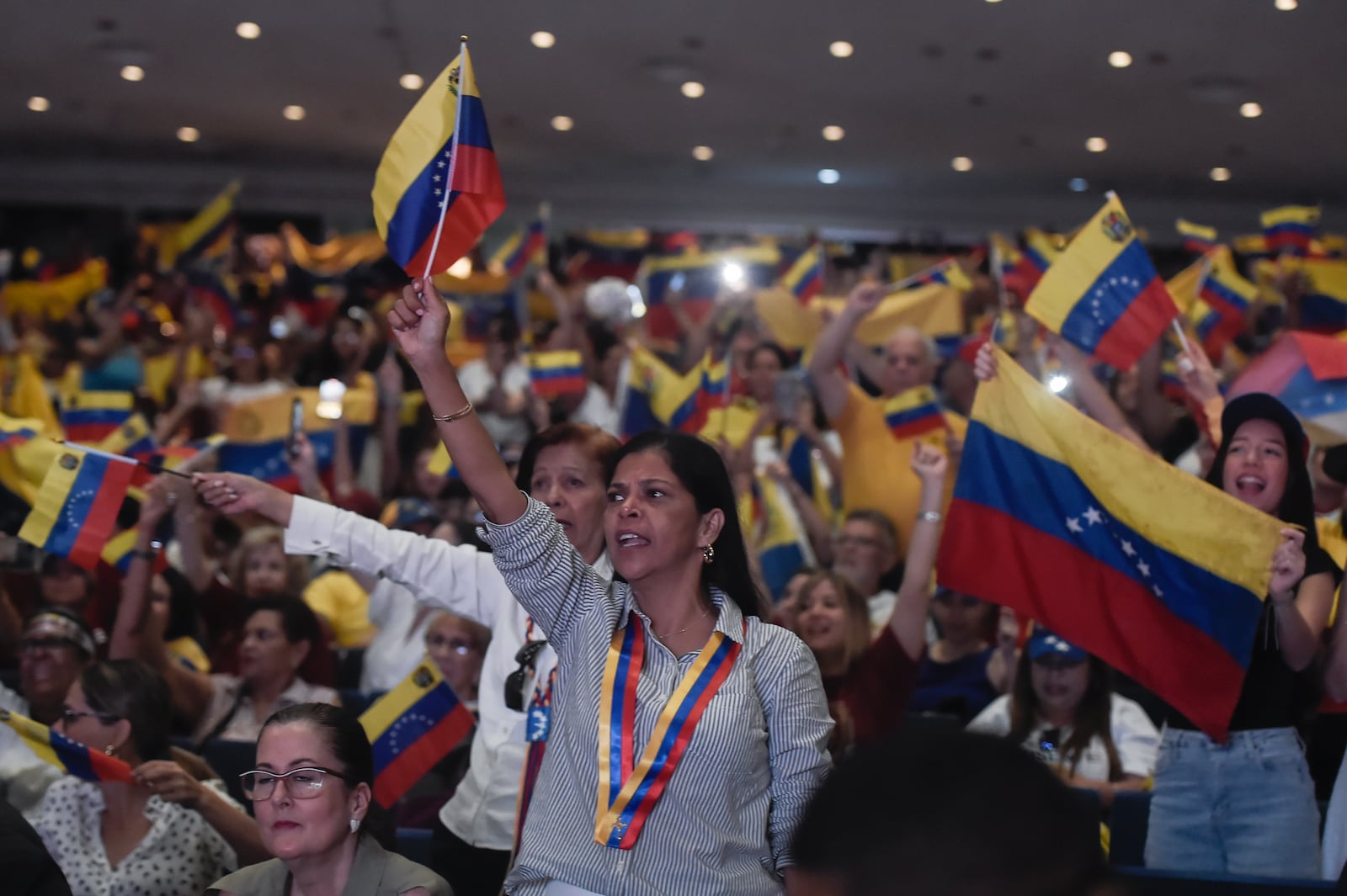 Supporters of Venezuela's opposition leader Edmundo Gonzalez gather during a meeting in Panama City, Wednesday, Jan. 8, 2025. (AP Photo/Agustin Herrera)