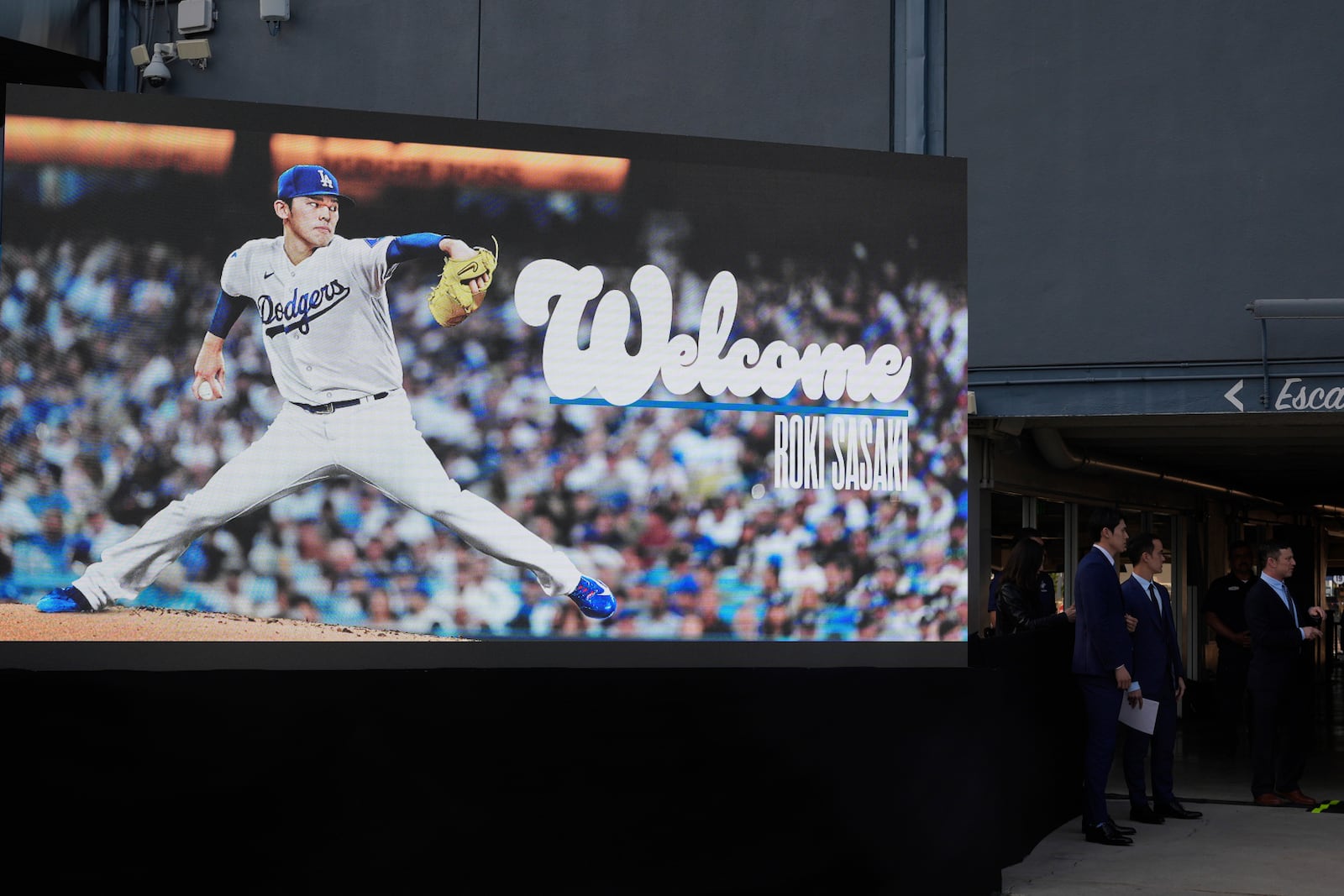 A digital display of Japanese right-hander pitcher Roki Sasaki, 23, is seen as he is introduced by the Los Angeles Dodgers at a news conference on Wednesday, Jan. 22, 2025, at Dodger Stadium in Los Angeles. (AP Photo/Damian Dovarganes)