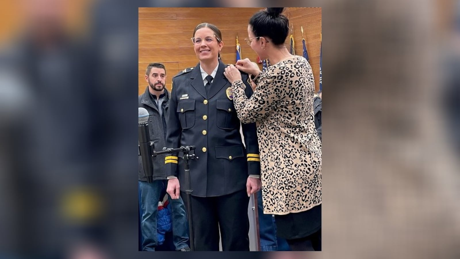 Allison Elliott, Springfield’s new police chief, receives help from her sister on Tuesday, Dec. 20, 2022. She took the oath and received new stripes and hardware for her uniform.