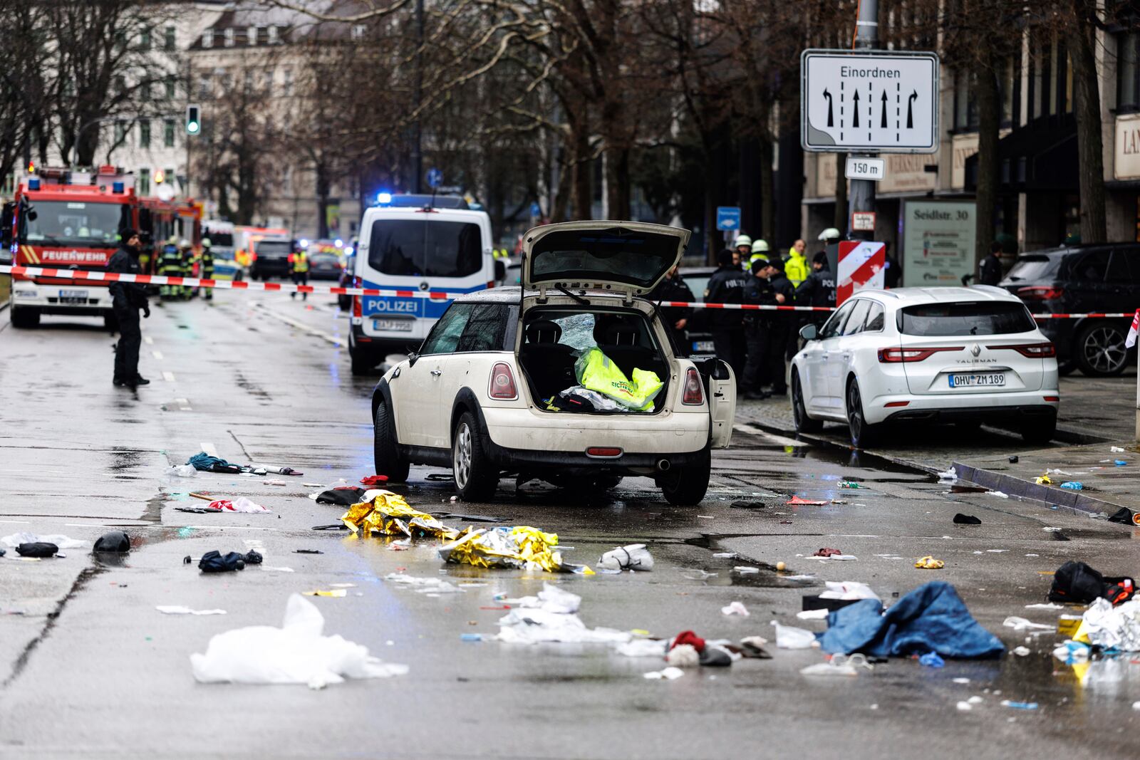 Emergency services attend the scene of an accident after a driver hit a group of people in Munich, Germany, Thursday Feb. 13, 2025. (Matthias Balk/dpa via AP)