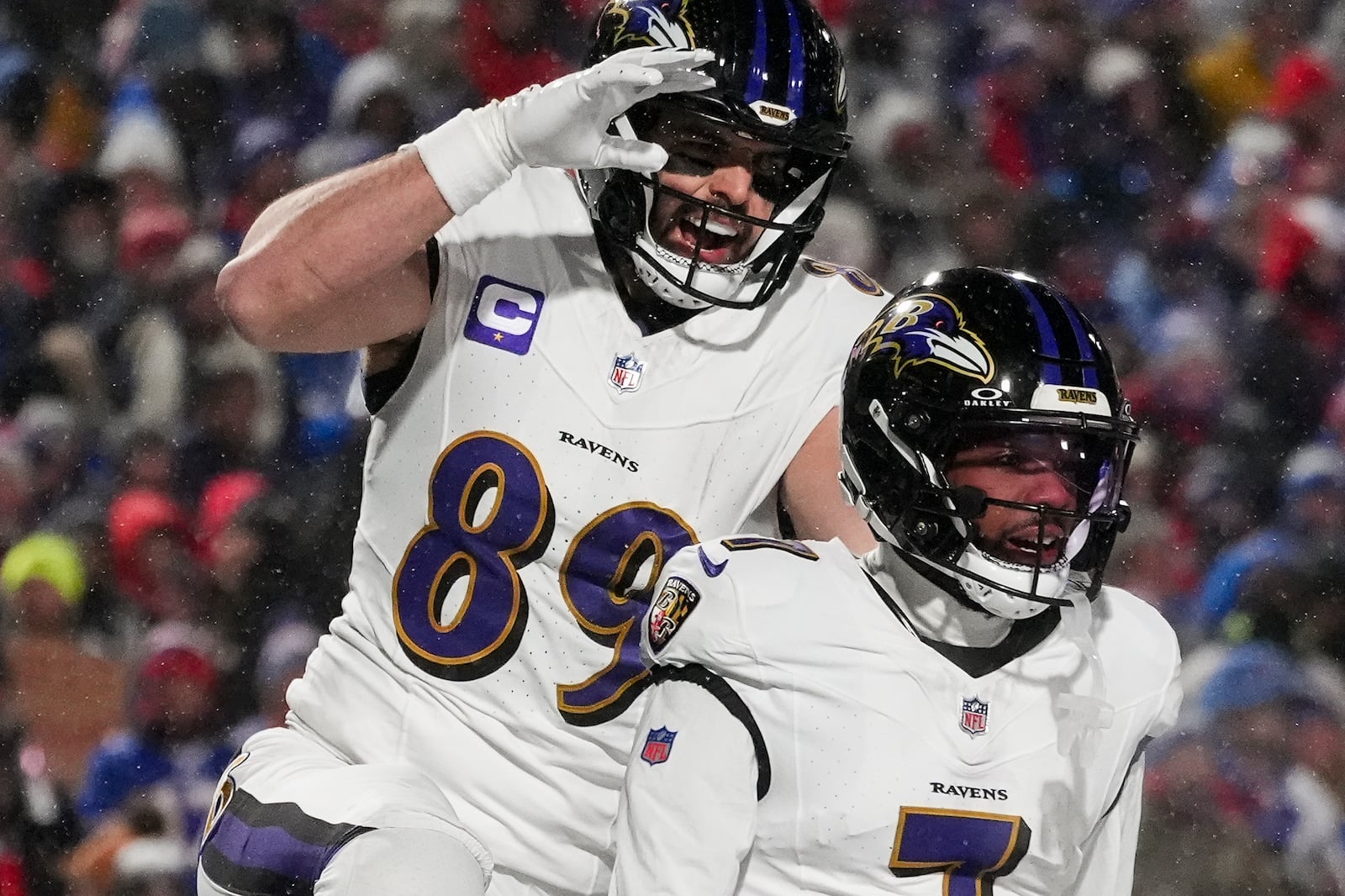 Baltimore Ravens tight end Mark Andrews (89) celebrates with wide receiver Rashod Bateman (7) after Bateman scored a touchdown against the Buffalo Bills during the first quarter of an NFL divisional playoff football game, Sunday, Jan. 19, 2025, in Orchard Park, N.Y. (AP Photo/Gene J. Puskar)