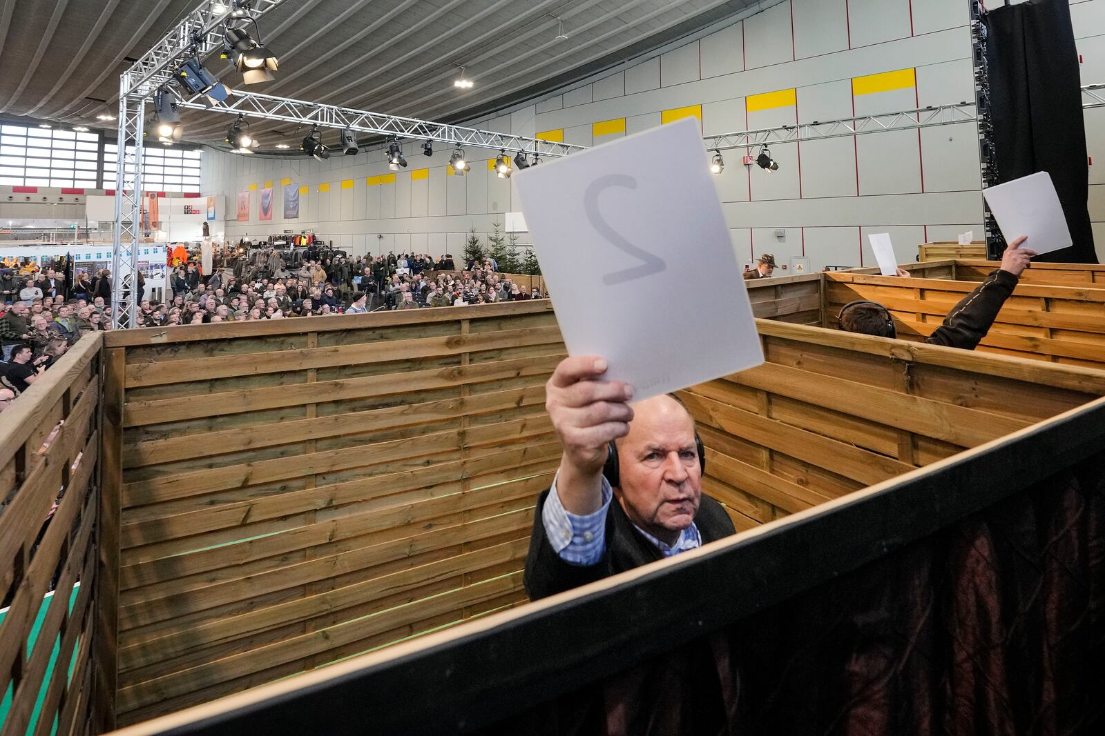 The jury gives her ratings in closed booths during the German Championship of Deer-Calling at the hunting fair in Dortmund, Germany, Friday, Jan. 31, 2025. (AP Photo/Martin Meissner)