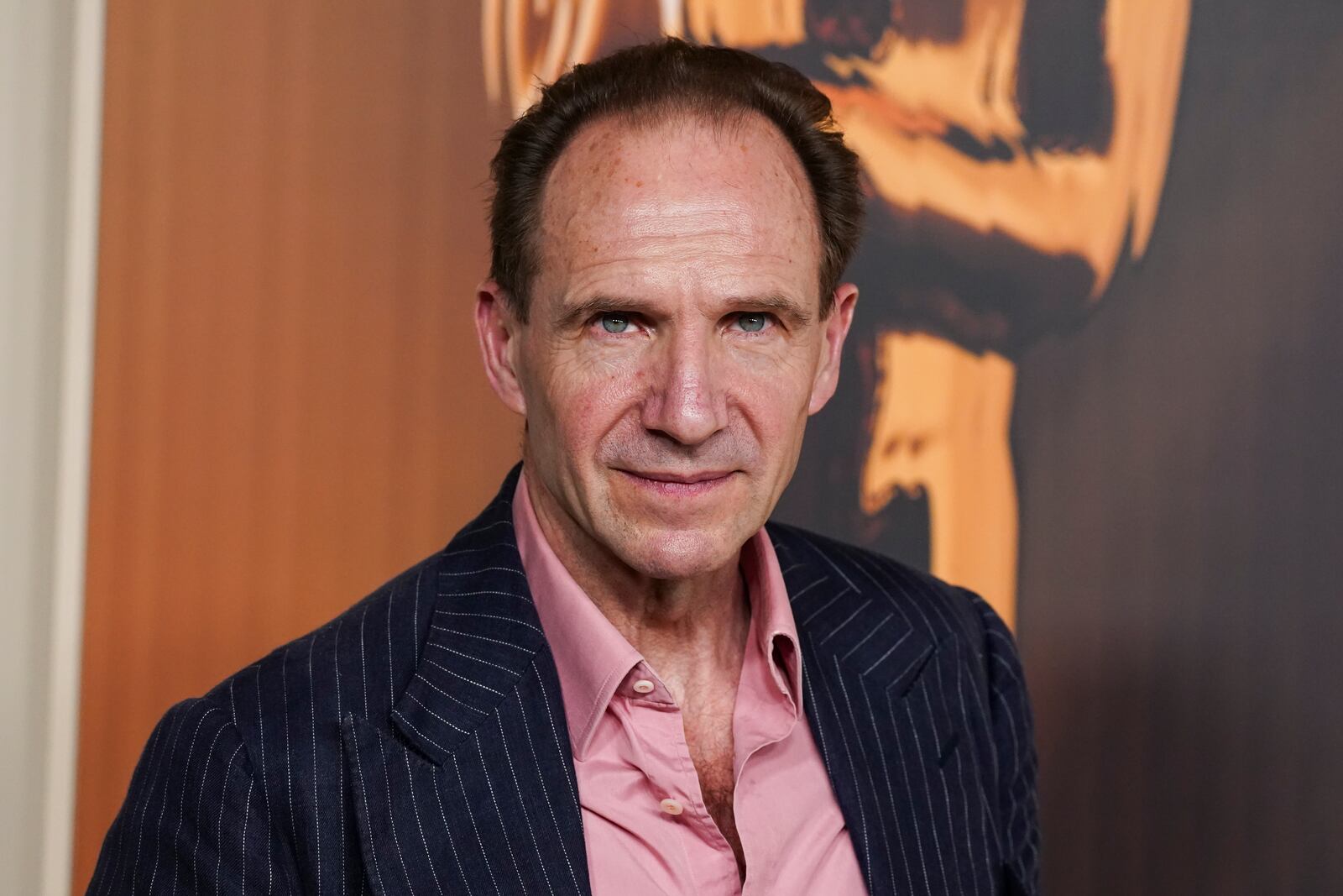 Ralph Fiennes arrives at the Oscars Nominees Dinner on Tuesday, Feb. 25, 2025, at the Academy Museum of Motion Pictures in Los Angeles. (Photo by Jordan Strauss/Invision/AP)