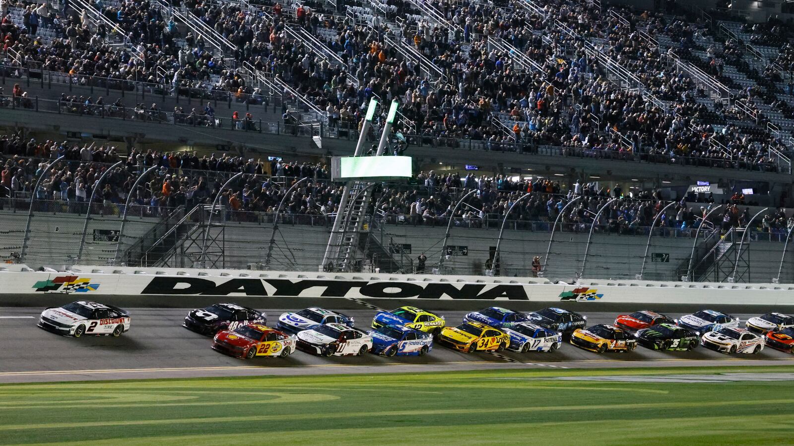 Austin Cindric (2) and Joey Logano (22) lead the field to start the second of two NASCAR Daytona 500 qualifying auto races at Daytona International Speedway, Thursday, Feb. 13, 2025, in Daytona Beach, Fla. (AP Photo/Terry Renna)