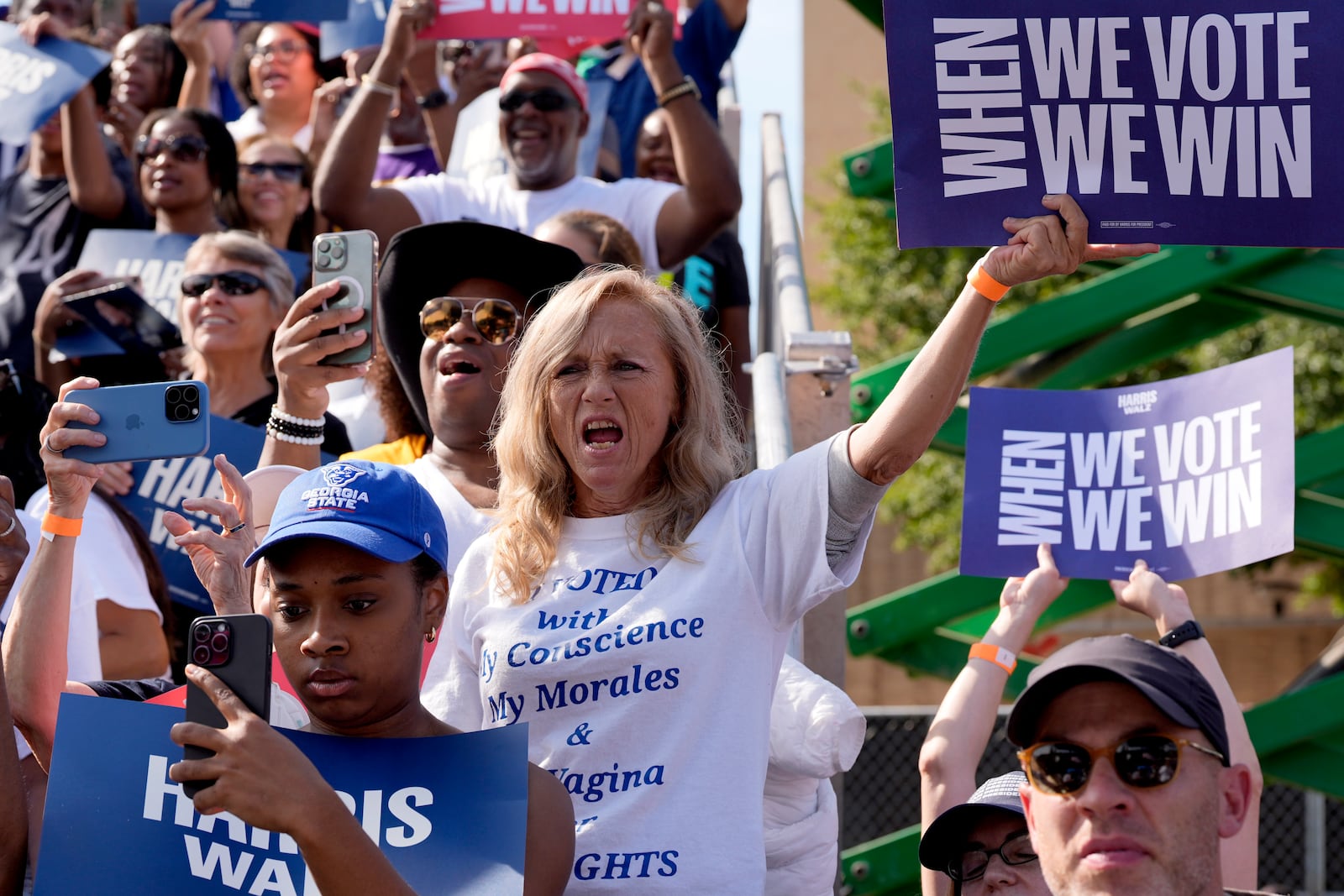 Supporters listen as Democratic presidential nominee Vice President Kamala Harris speaks during a campaign rally outside the Atlanta Civic Center, Saturday, Nov. 2, 2024. (AP Photo/Jacquelyn Martin)