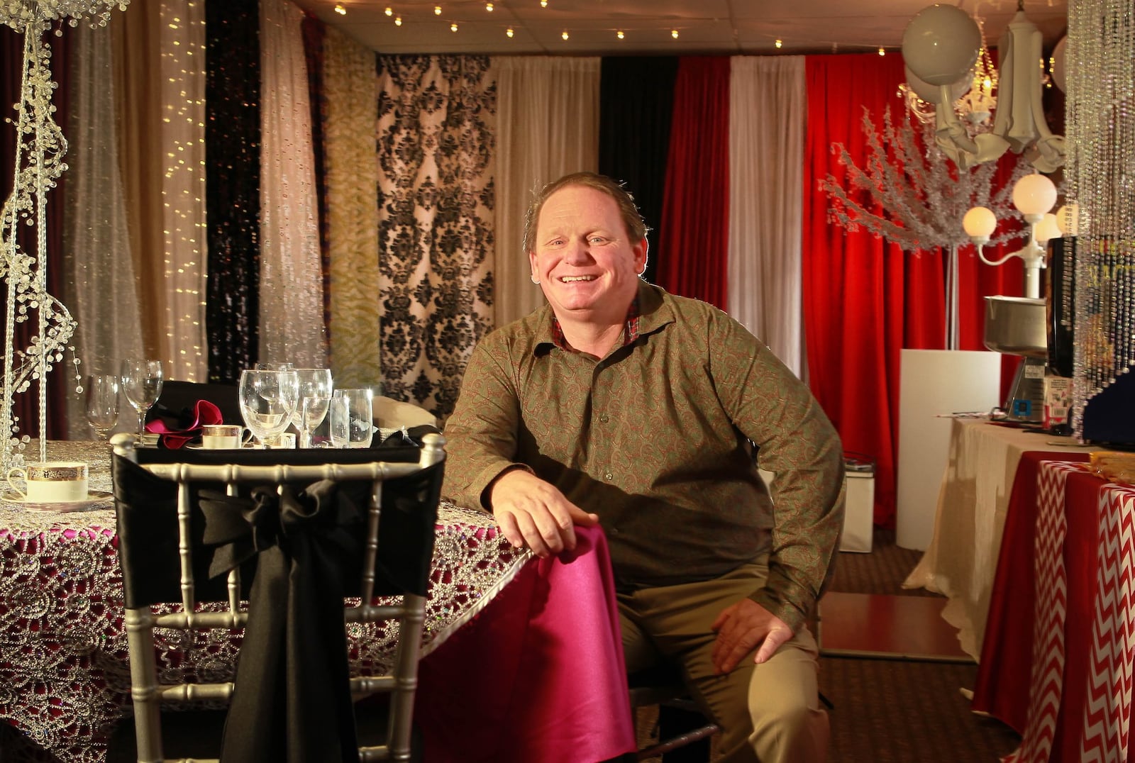 Bart Nye, Prime Time Party Rental Inc. owner, is seated in a section of his showroom which will move to a new, expanded location in West Carrollton, with the goal of doubling its business over the next three years, Nye said Friday. The party rental company will move to an 86,000-square-foot facility at 5225 Springboro Pike, where it plans to add another 12,000 square feet of space, Nye said. JIM WITMER / STAFF ARTICLE: Prime Time Party Rental plans $2M expansion