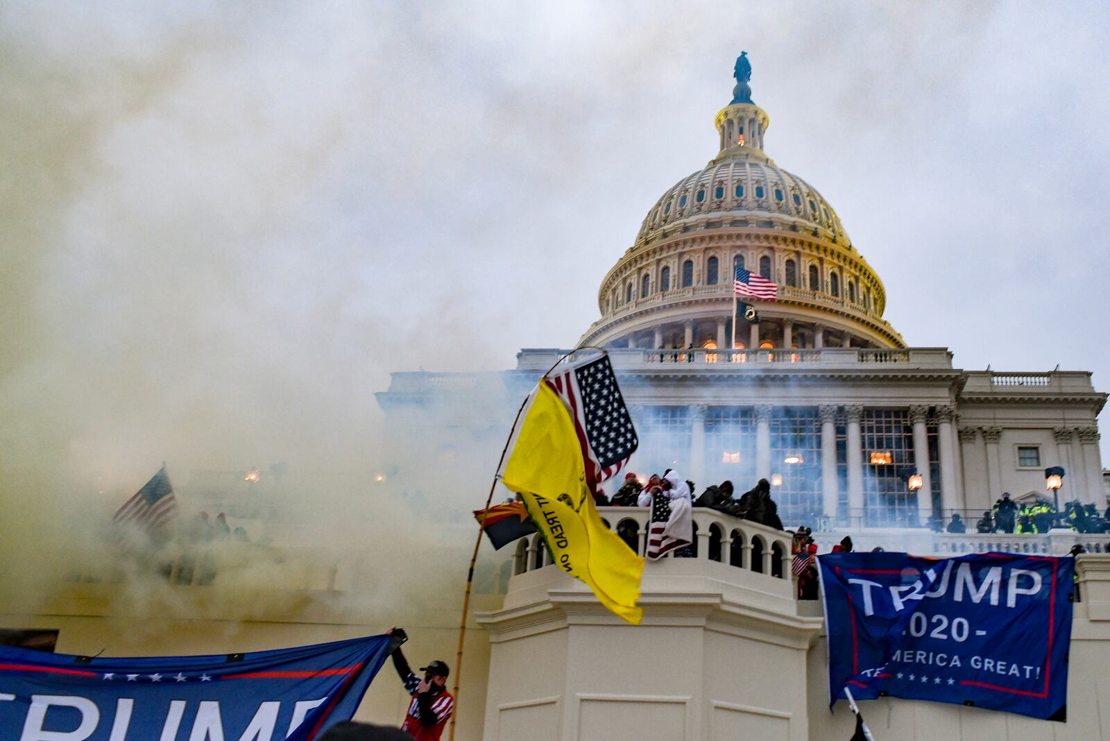 
                        FILE — Teargas is deployed by the authorities as supporters of President Donald Trump breach the Capitol building in Washington, Jan. 6, 2021. A Jan. 6 rioter who was pardoned by President Trump and released from prison last week is being sought on preexisting charges in Texas of soliciting a minor online. (Kenny Holston/The New York Times)
                      