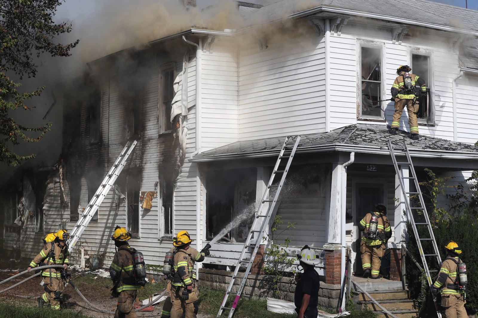 The Springfield Fire Division battled a residential fire at 822 Kenton Street Friday afternoon. BILL LACKEY/STAFF