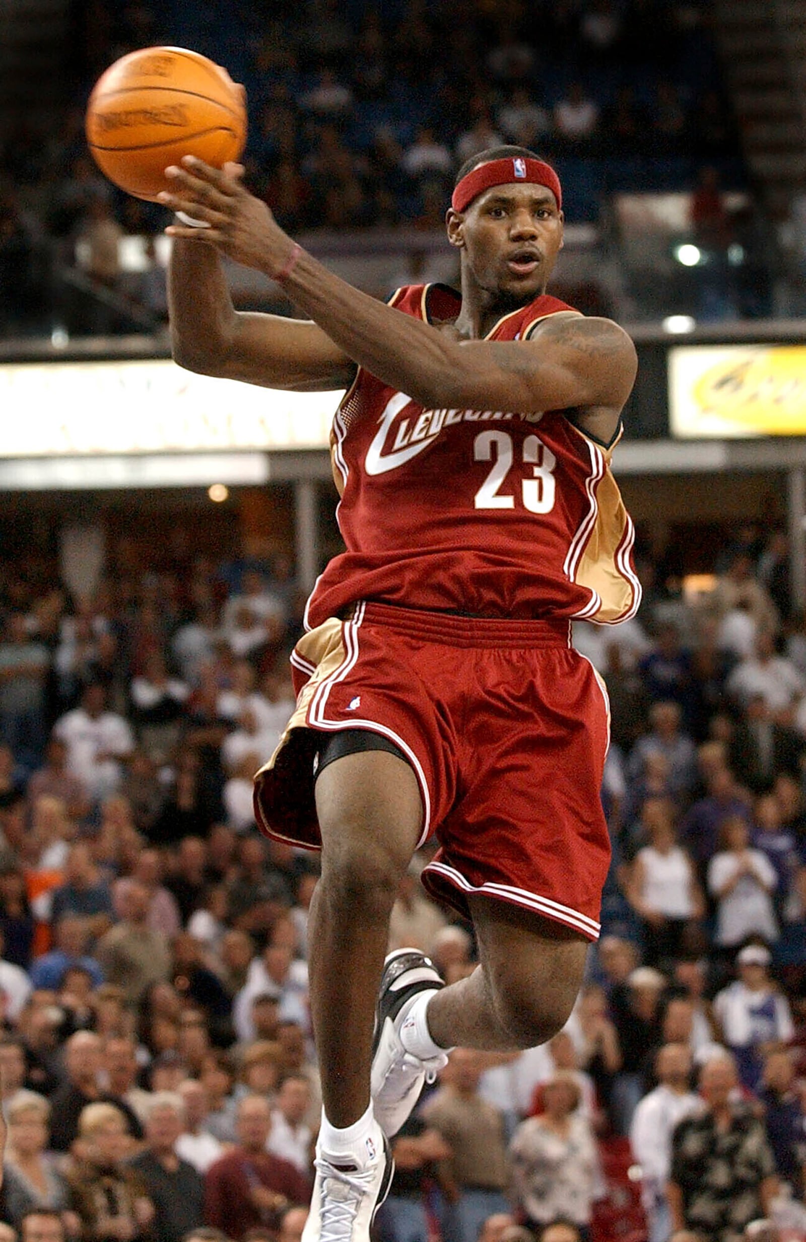 FILE - Cleveland Cavaliers guard LeBron James passes the ball off as he drives the lane against the Sacramento Kings during the second half at Arco Arena in Sacramento, Calif., on Oct. 29, 2003. (AP Photo/Steve Yeater, File)