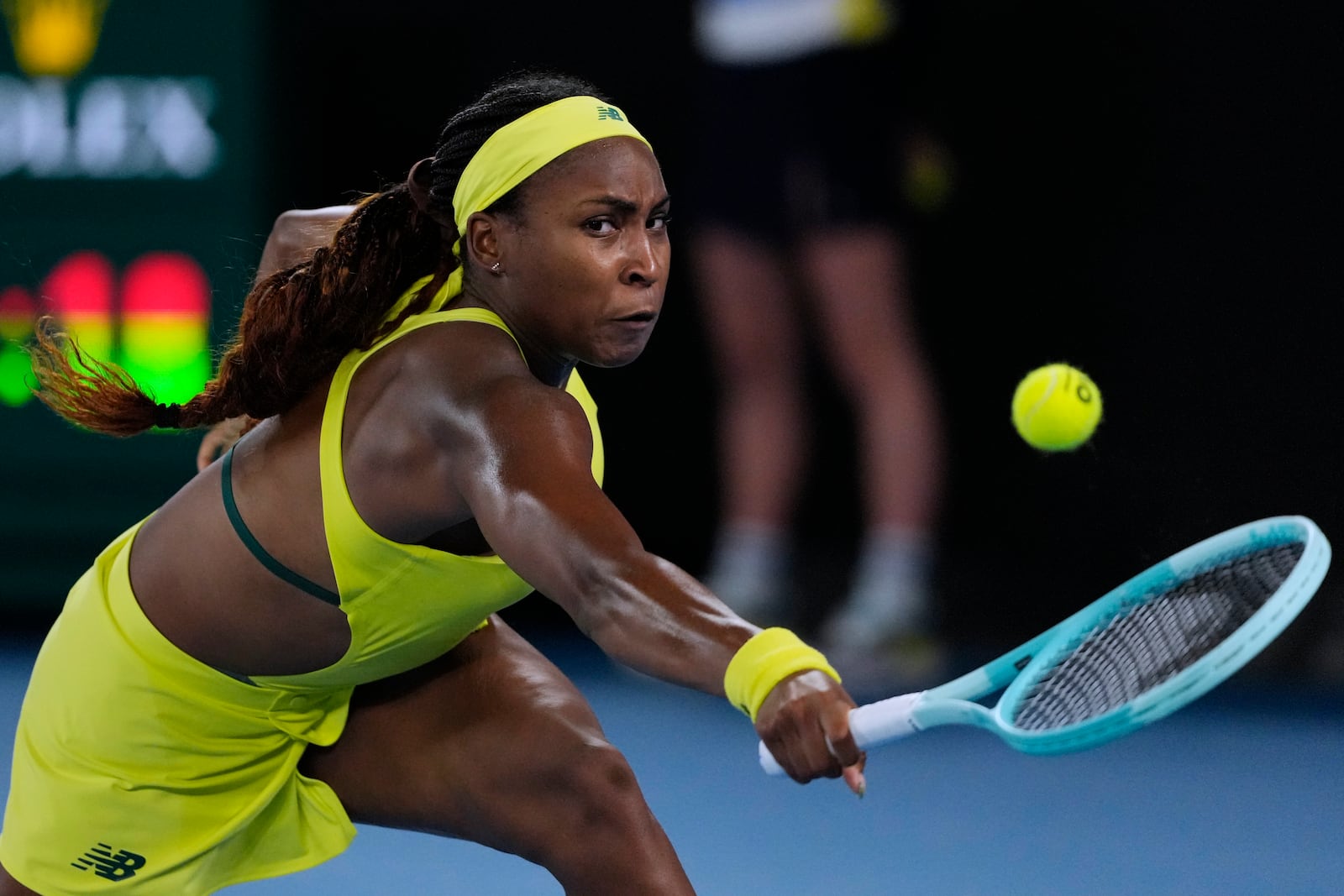 Coco Gauff of the U.S. plays a backhand return to Jodie Burrage of Britain during their second round match at the Australian Open tennis championship in Melbourne, Australia, Wednesday, Jan. 15, 2025. (AP Photo/Vincent Thian)