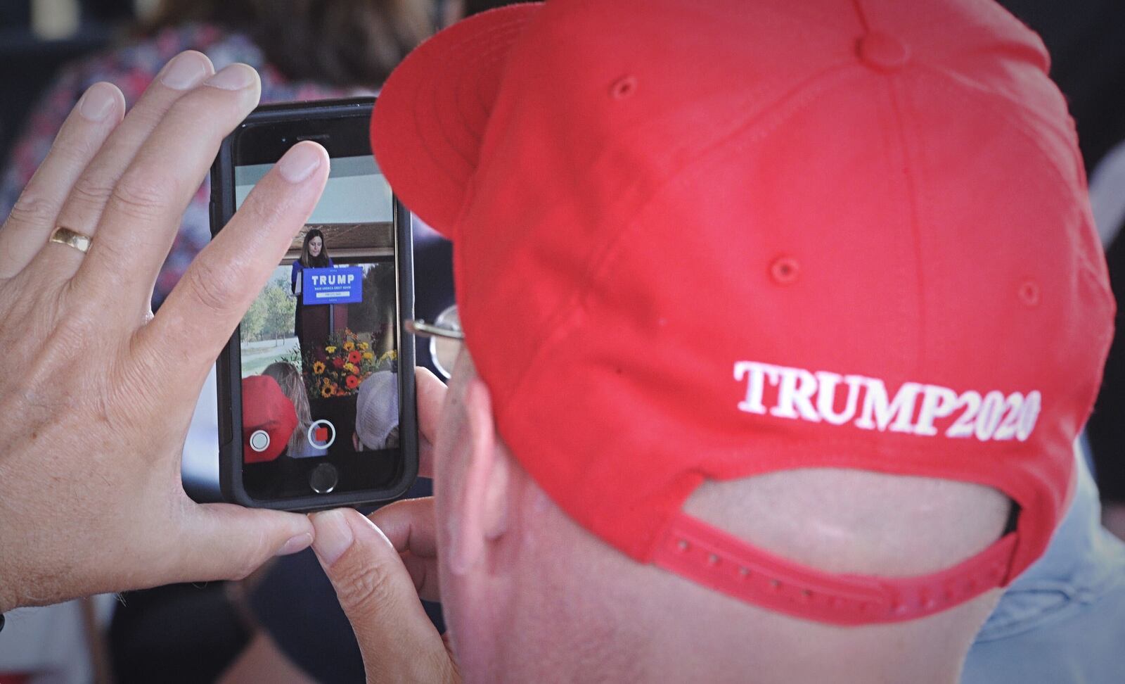 A Trump supporter takes cellphone video of second lady Karen Pence during her visit Thursday, Oct. 22, 2020, in Tipp City. MARSHALL GORBY/STAFF