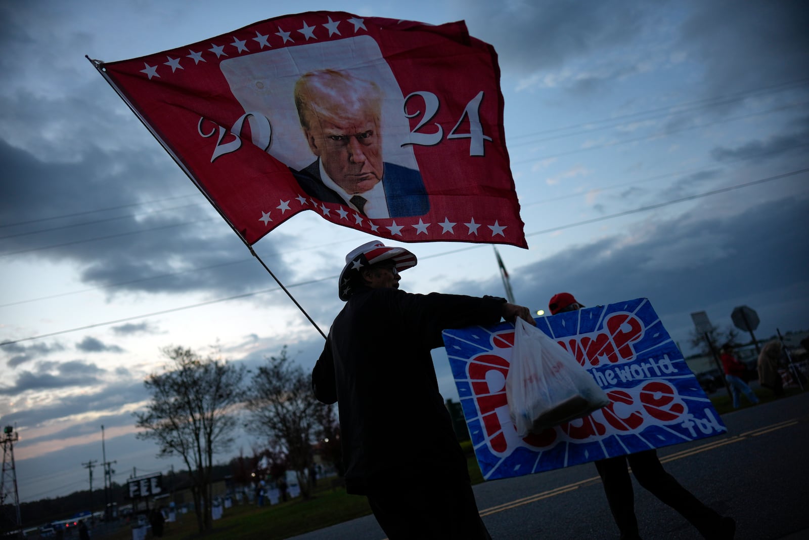 Supporters arrive before Republican presidential nominee former President Donald Trump speaks at a campaign rally in Gastonia, N.C., Saturday, Nov. 2, 2024. (AP Photo/Chris Carlson)