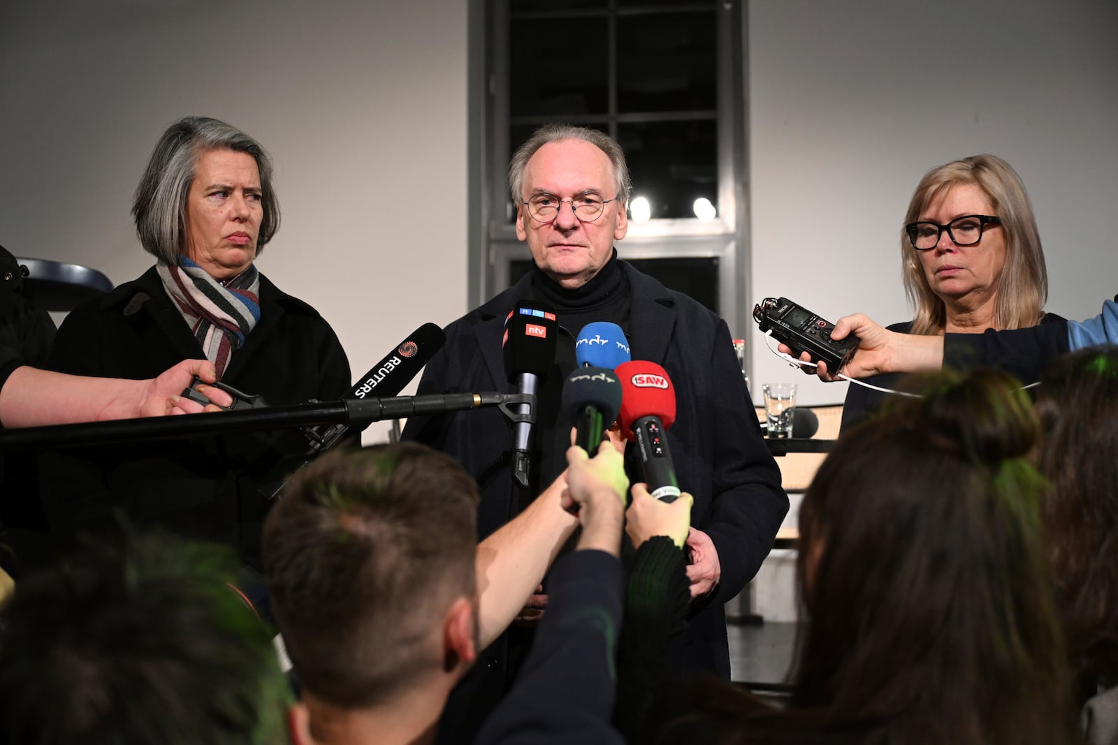 Reiner Haseloff, Minister President of Saxony-Anhalt, center, is flanked by Tamara Zieschang, Minister of the Interior and Sport of Saxony-Anhalt, left, and Simone Borris, Mayor of the City of Magdeburg, at a press conference after a car plowed into a busy outdoor Christmas market in Magdeburg, Germany Friday, Dec. 20, 2024. (Hendrik Schmidt/dpa via AP)