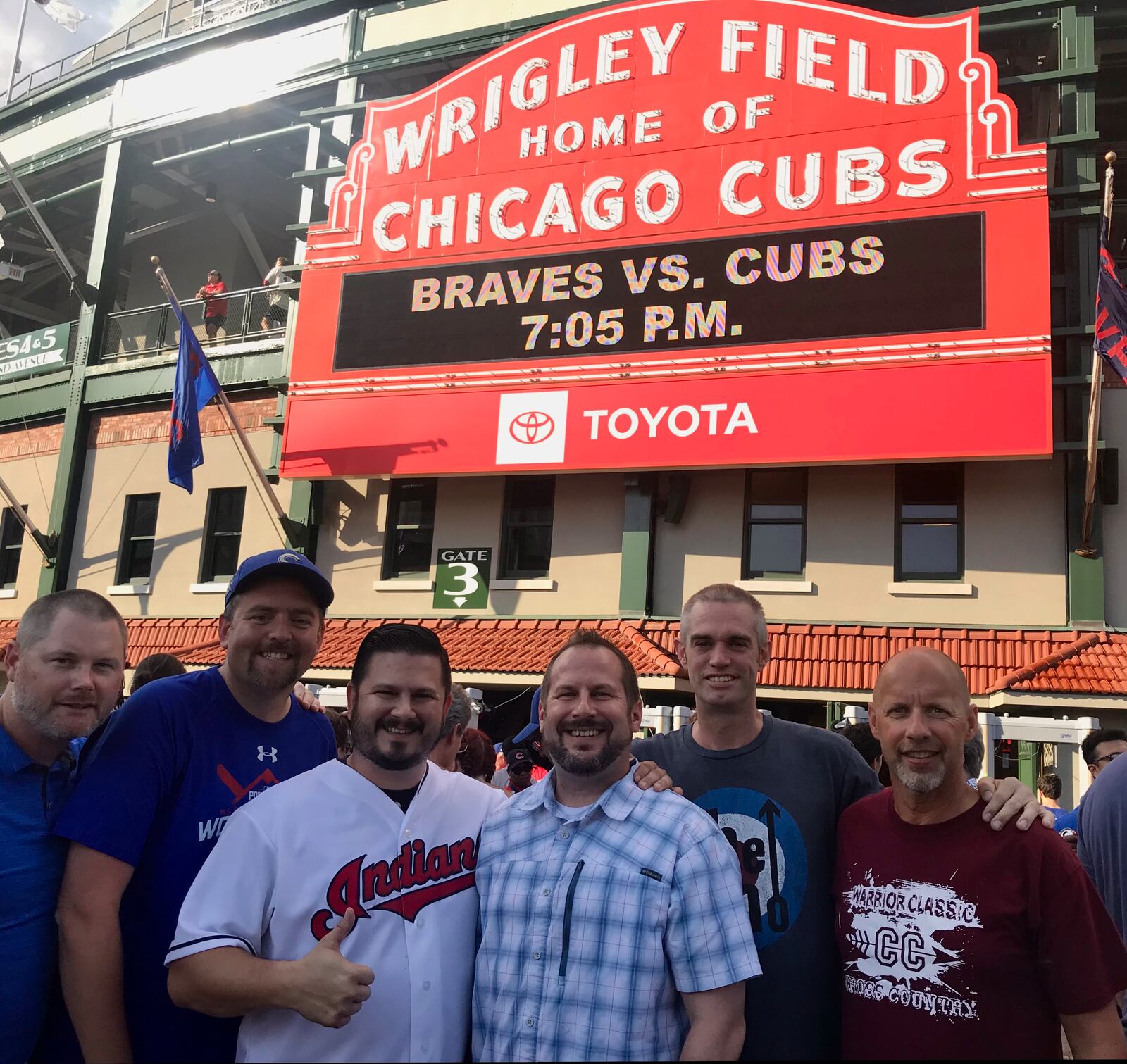 Brent Parke, second from right, and friends visit Wrigley Field in 2019.