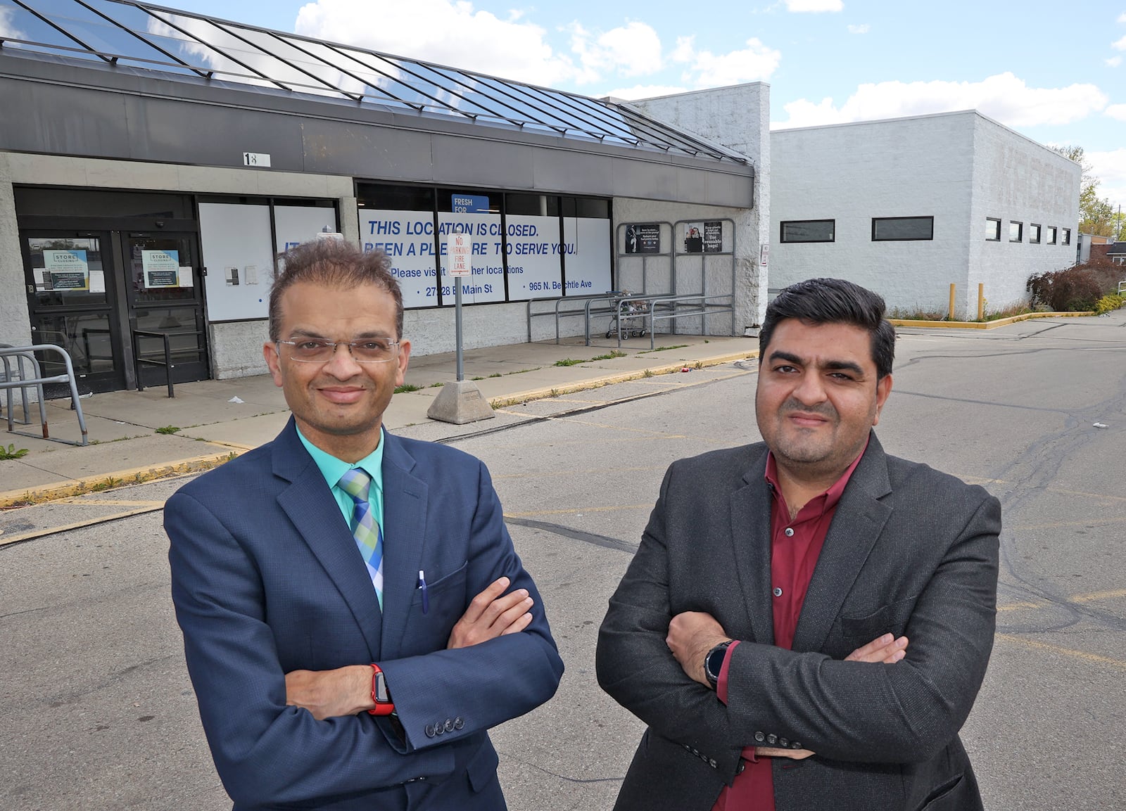 Groceryland owners Dr. Vipul Patel, left, and his business partner, Ravindra Patel, at the old Kroger site on South Limestone Street where they plan to open a new grocery store. BILL LACKEY/STAFF