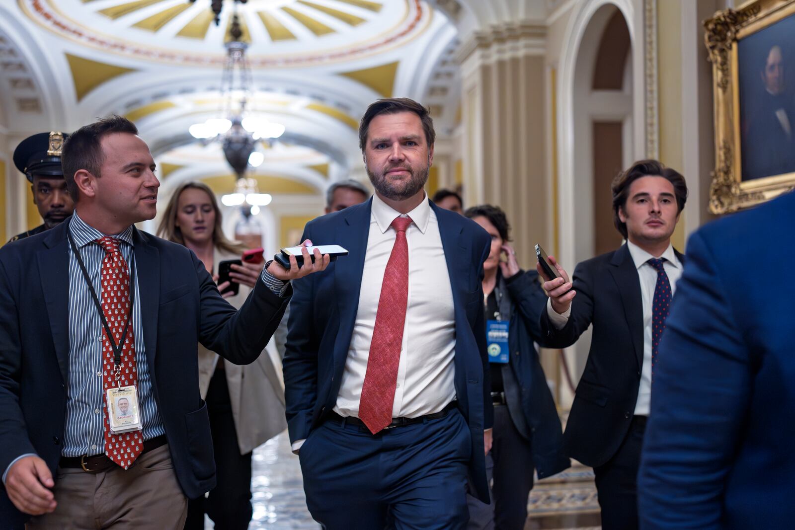 Sen. JD Vance, R-Ohio, the vice president-elect, leaves the Senate chamber as lawmakers work on an interim spending bill to avoid a shutdown of federal agencies, at the Capitol in Washington, Wednesday, Dec. 18, 2024. (AP Photo/J. Scott Applewhite)