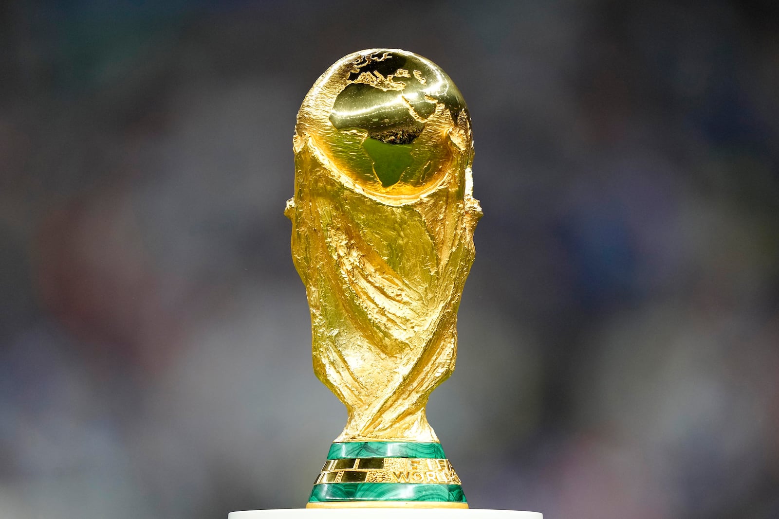 FILE - The trophy is displayed on the pitch ahead of the World Cup final soccer match between Argentina and France at the Lusail Stadium in Lusail, Qatar, Dec. 18, 2022. (AP Photo/Martin Meissner, File)