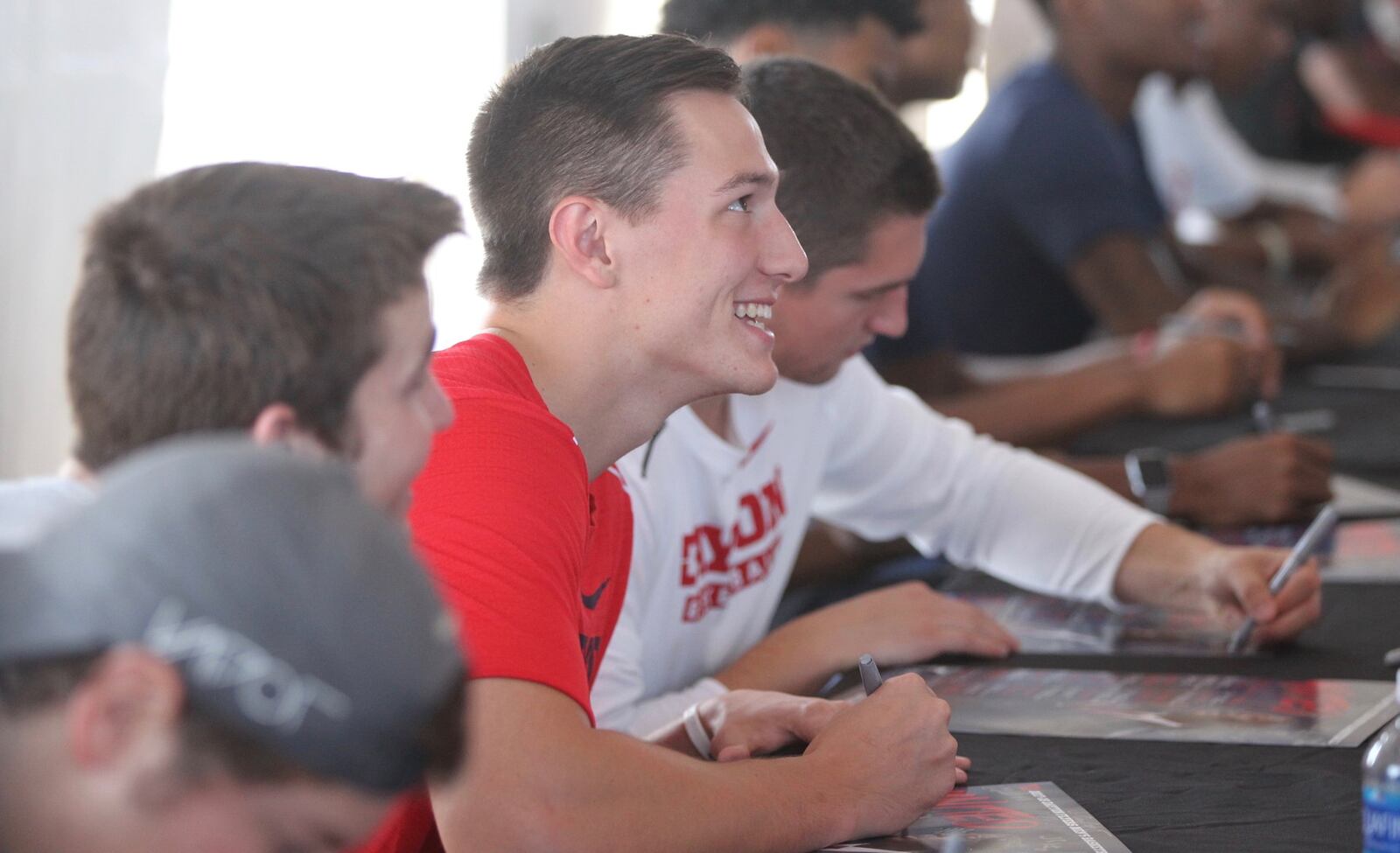 Dayton’s Ryan Mikesell signs autographs during a basketball fan fest event on Saturday, Oct. 14, 2017, at Welcome Stadium in Dayton. David Jablonski/Staff