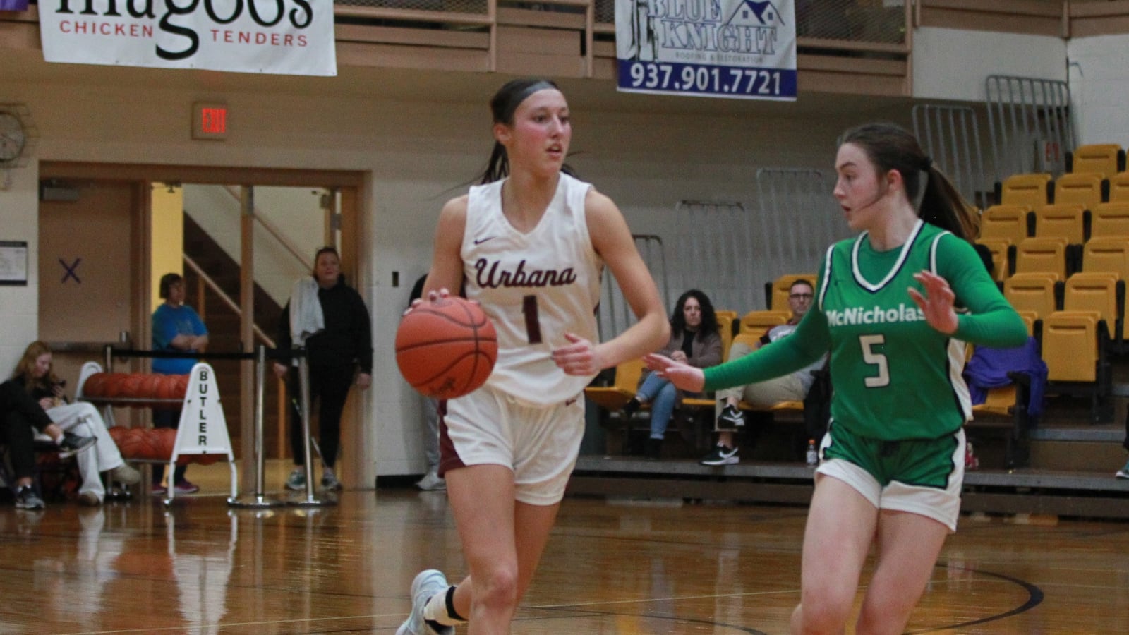 Urbana girls basketball senior Peyton Moucne dribbles the ball in a regional semifinal loss to Cincinnati McNicholas at Butler High School Feb. 25, 2025.