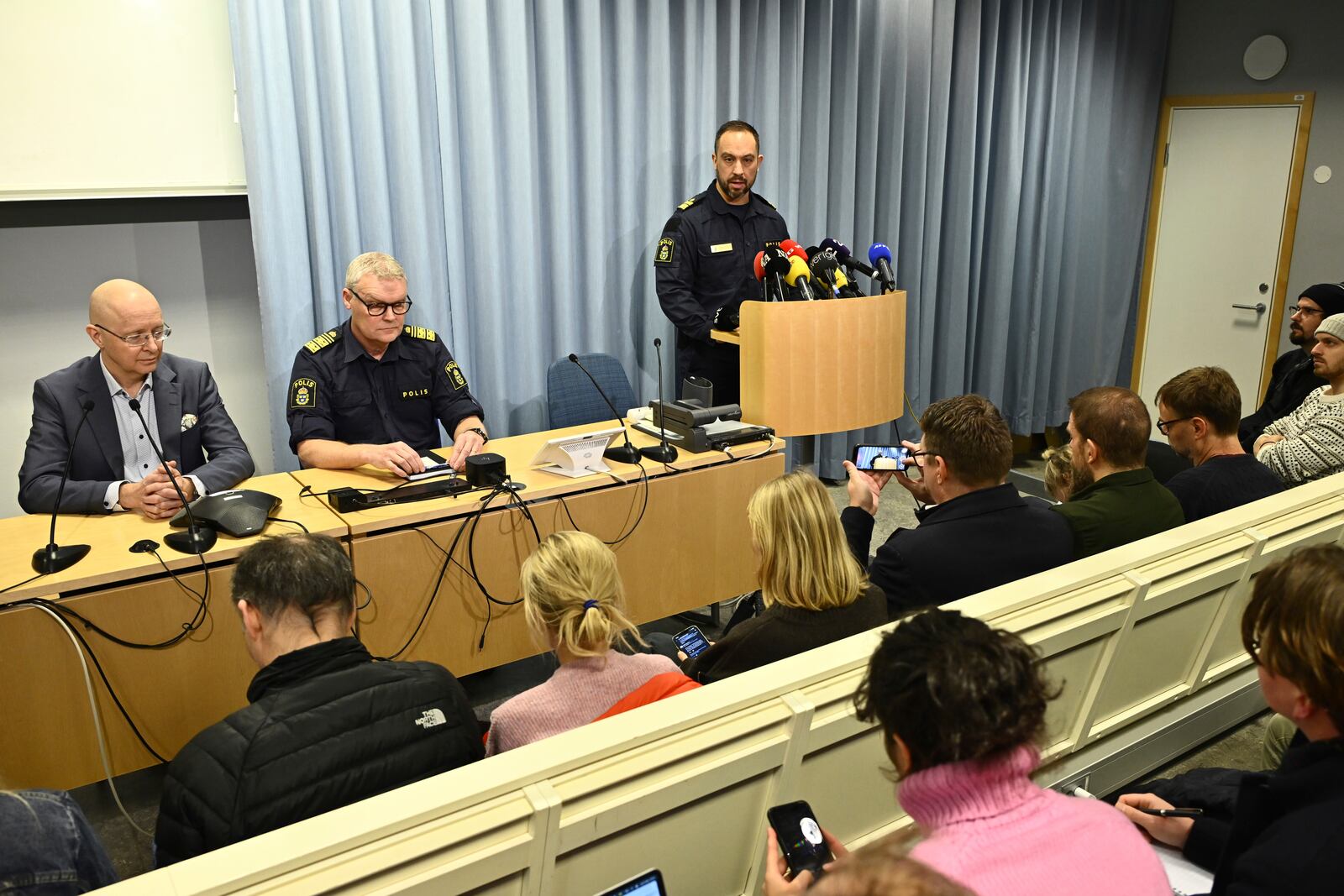 Roberto Eid Forest, head of the Orebro local police area speaks at a press conference with Director of Health Jonas Claesson, left, and Lars Wirén, Chief of Police in Örebro, Sweden, Wednesday Feb. 5, 2025, after a shooting at an adult education center on Tuesday. (Anders Wiklund/TT via AP)