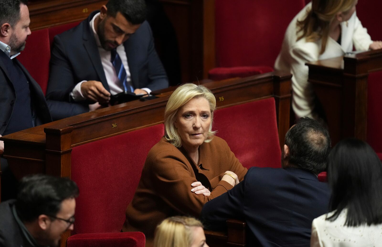 French far-right leader Marine Le Pen sits at the National Assembly before French Prime Minister Francois Bayrou delivers his general policy speech meant to outline his top priorities, Tuesday, Jan. 14, 2025 in Paris. (AP Photo/Thibault Camus)