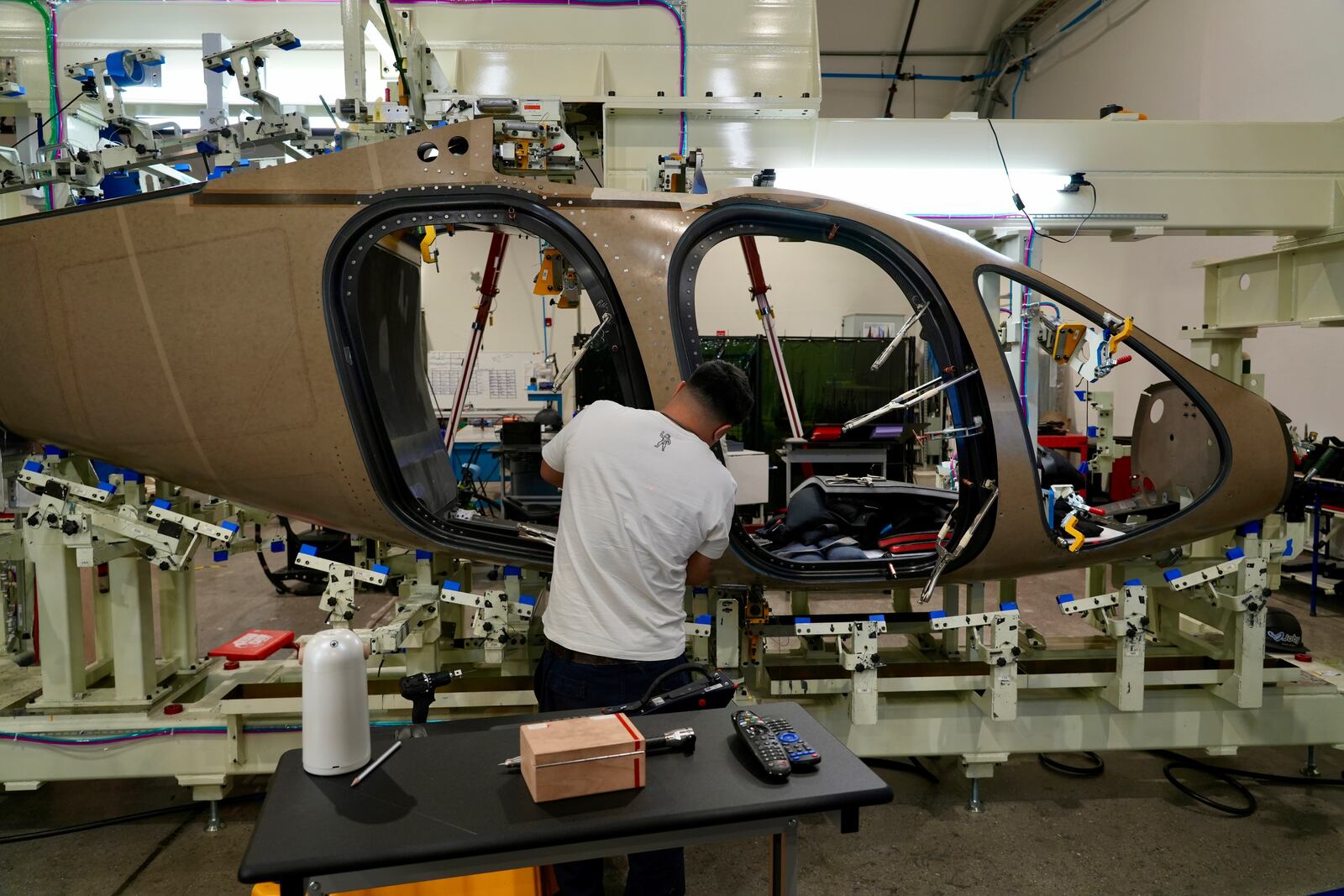 A Joby Aviation employees works on the assembly of an "electric vertical takeoff and landing" eVTOL aircraft in Marina, Calif. on Monday, Oct. 7, 2024. (AP Photo/Terry Chea)