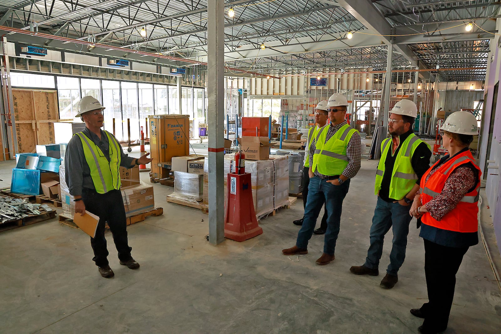 Members of the Global Impact STEM Academy Board of Directors took a tour of the school's new Upper Academy under construction on the Clark State College Leffel Lane campus Tuesday, Oct. 8, 2024. BILL LACKEY/STAFF